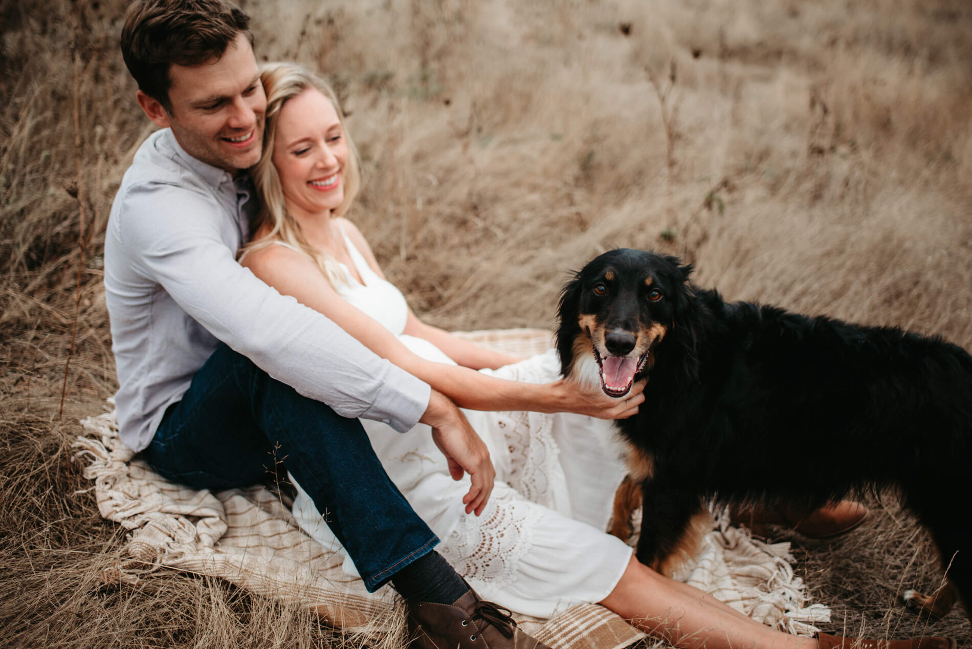 Outdoor couple maternity photography with a pet in the Seattle area