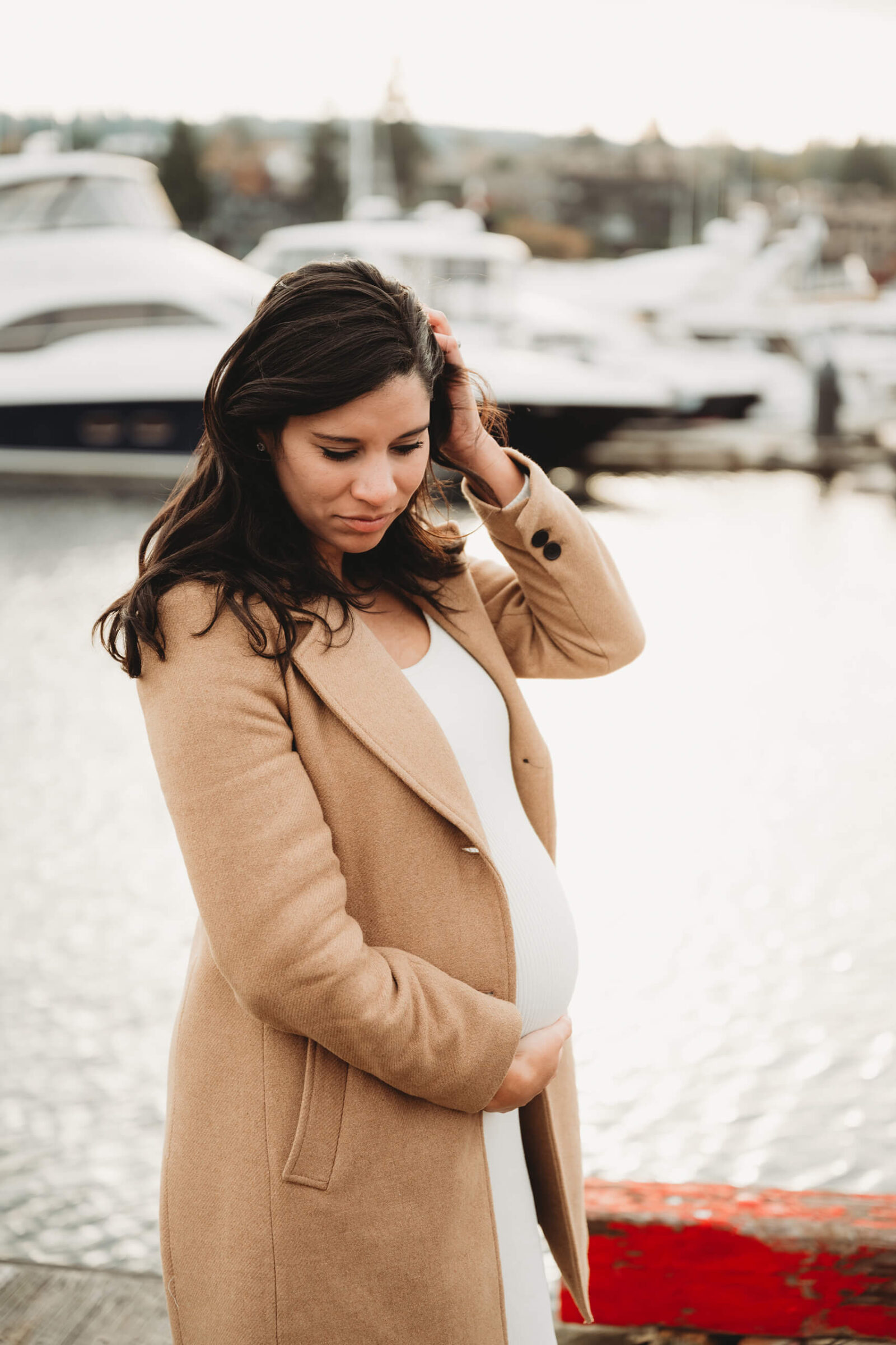 Woman posing during a winter maternity photo shoot in Kirkland, WA
