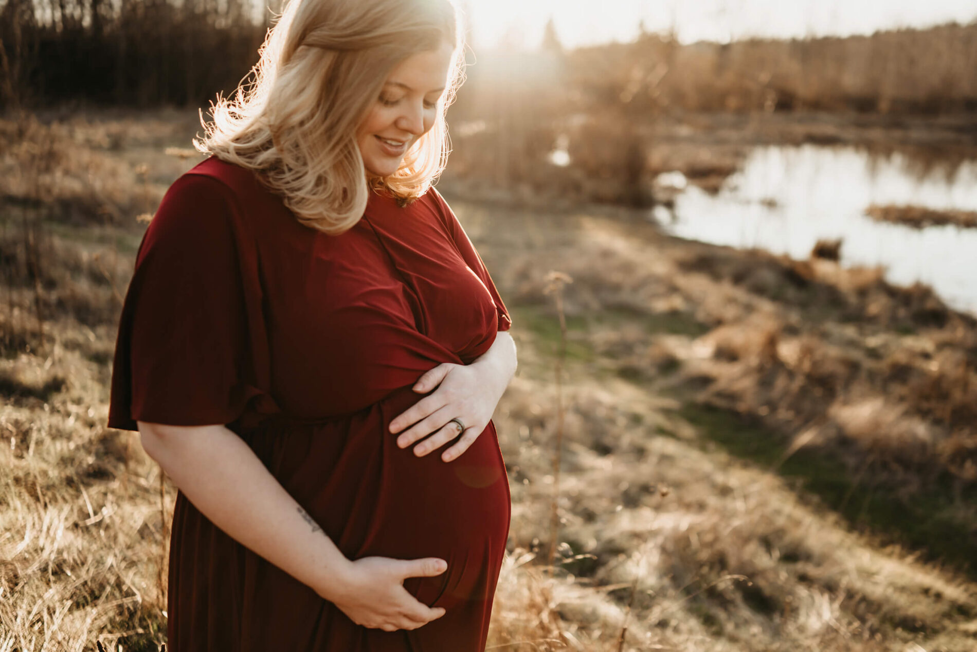 Maternity photoshoot in the Seattle area with mom hugging her belly