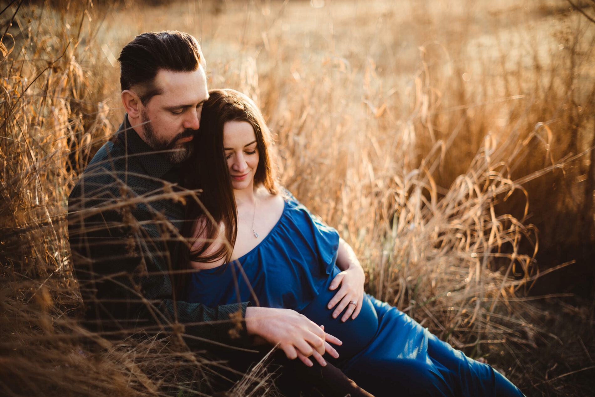 A couple lovingly hugging during a maternity photoshoot in the Seattle area