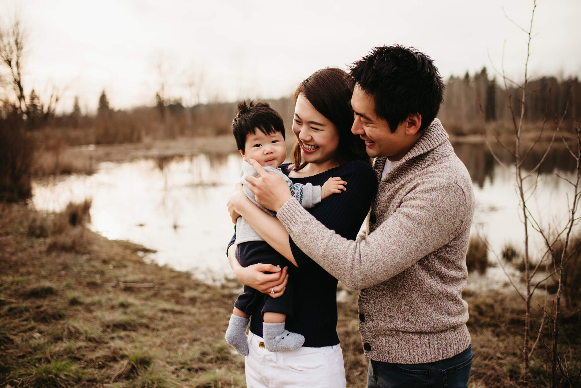 Family lifestyle photo session during winter with two parents and their toddler son