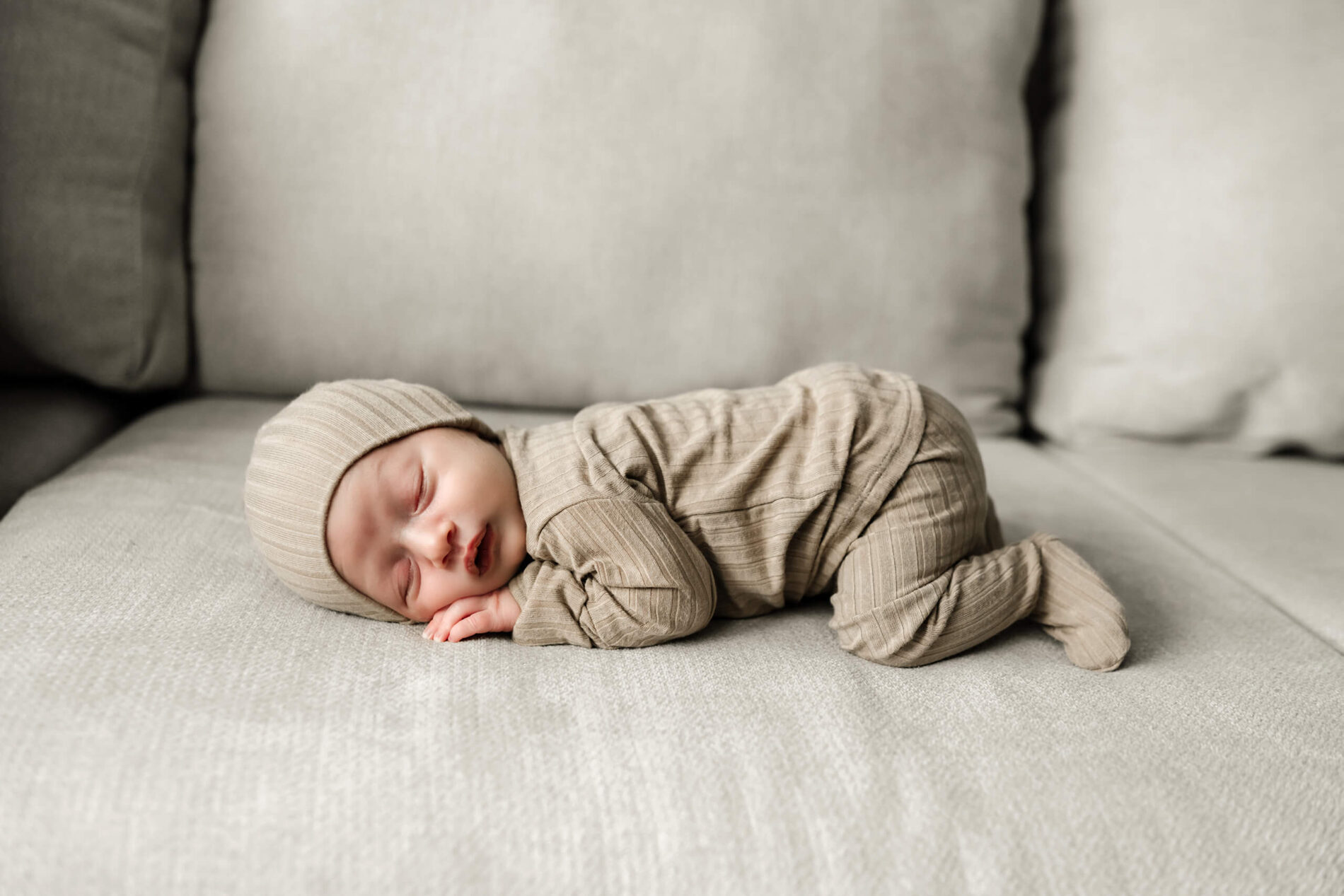Unposed newborn photography during in home photo shoot