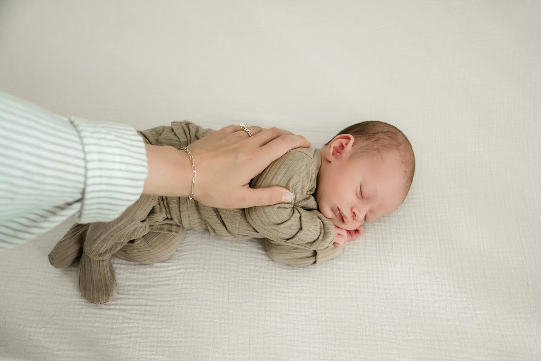Newborn photo with mom during newborn in home photo shoot