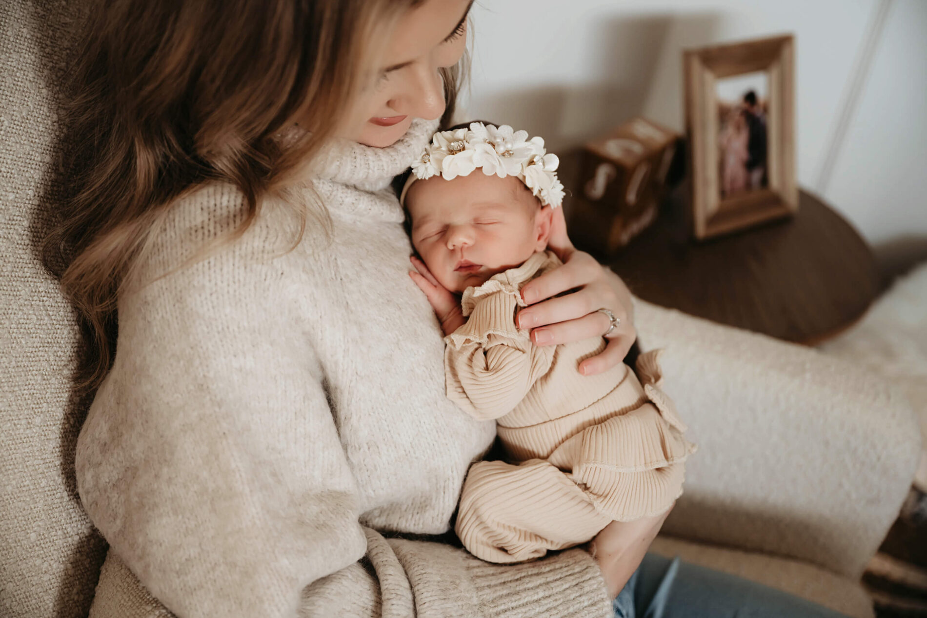 Newborn photos with mom in a nursery during a newborn in home photo session