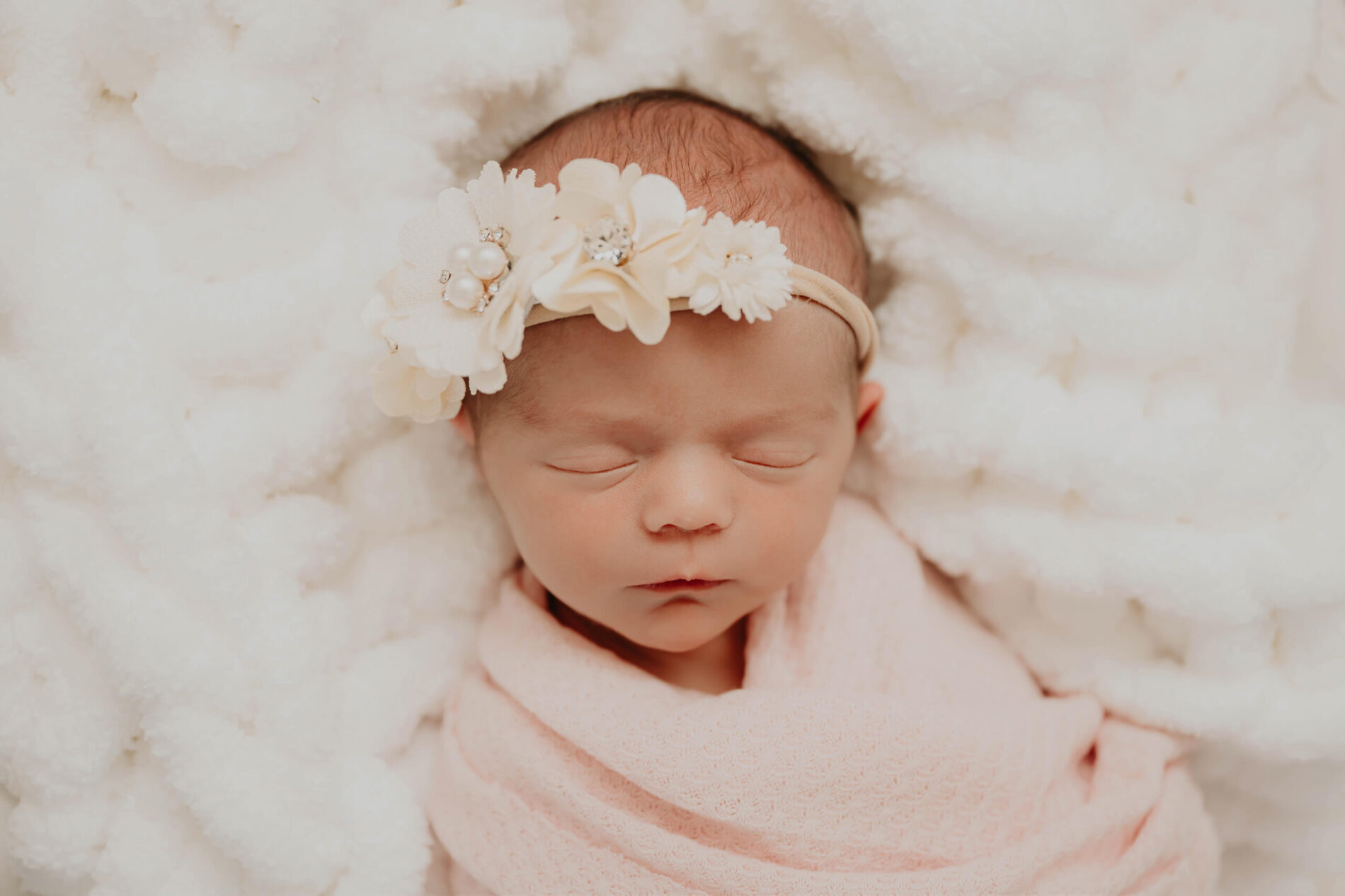 Natural light newborn photo of a sleeping baby girl