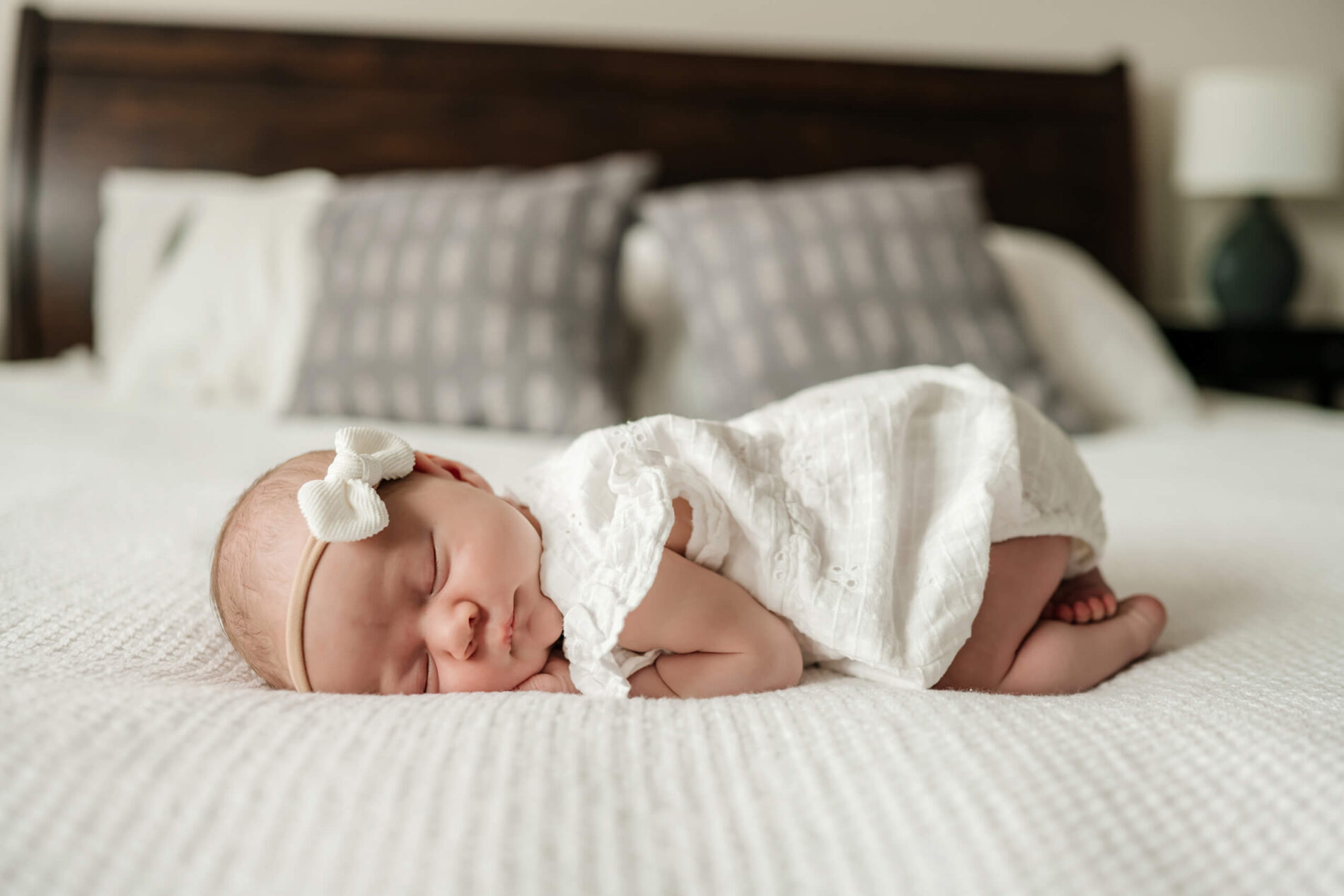 Idea to pose a baby girl during in home newborn photo shoot