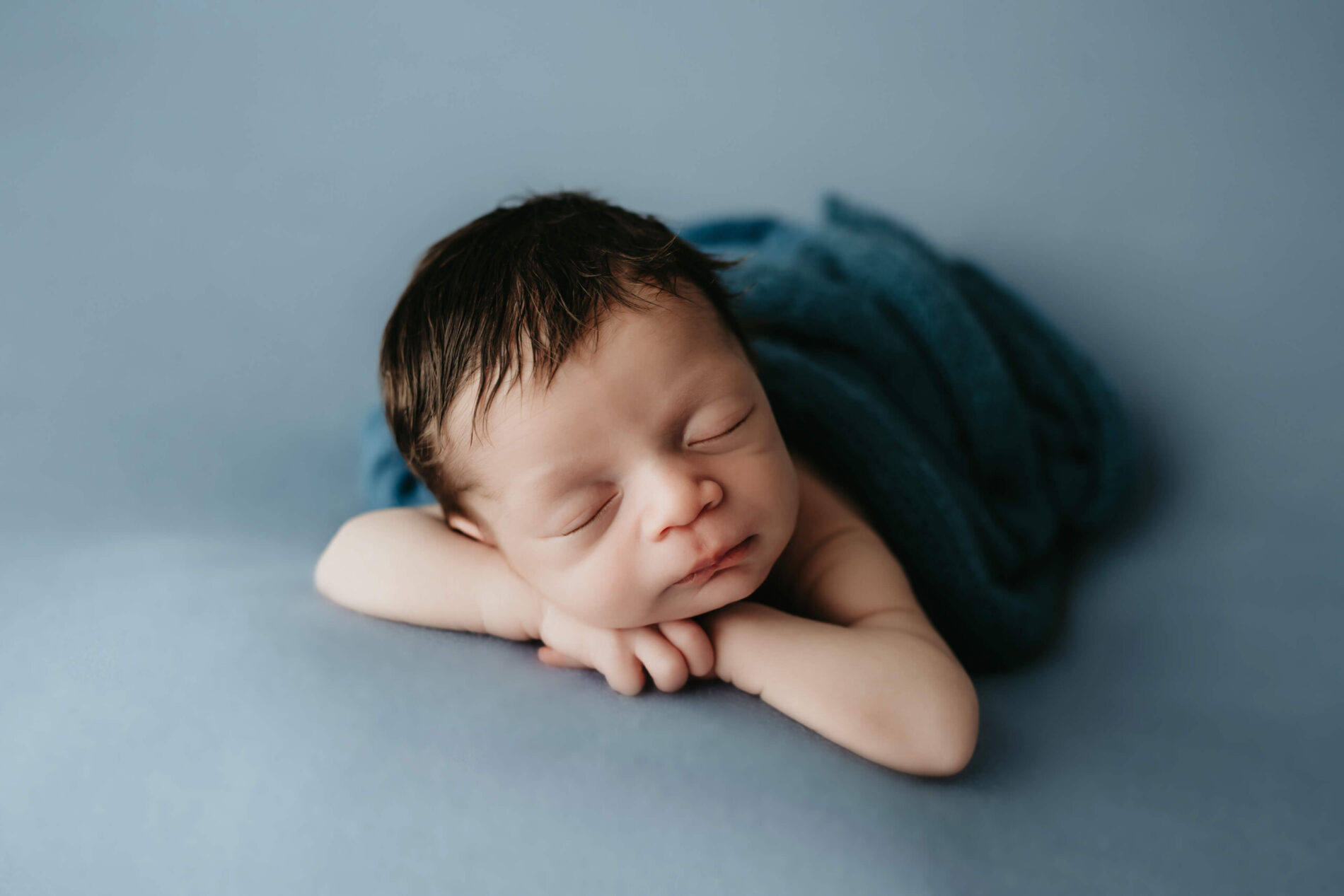 Newborn photo of baby boy in a studio
