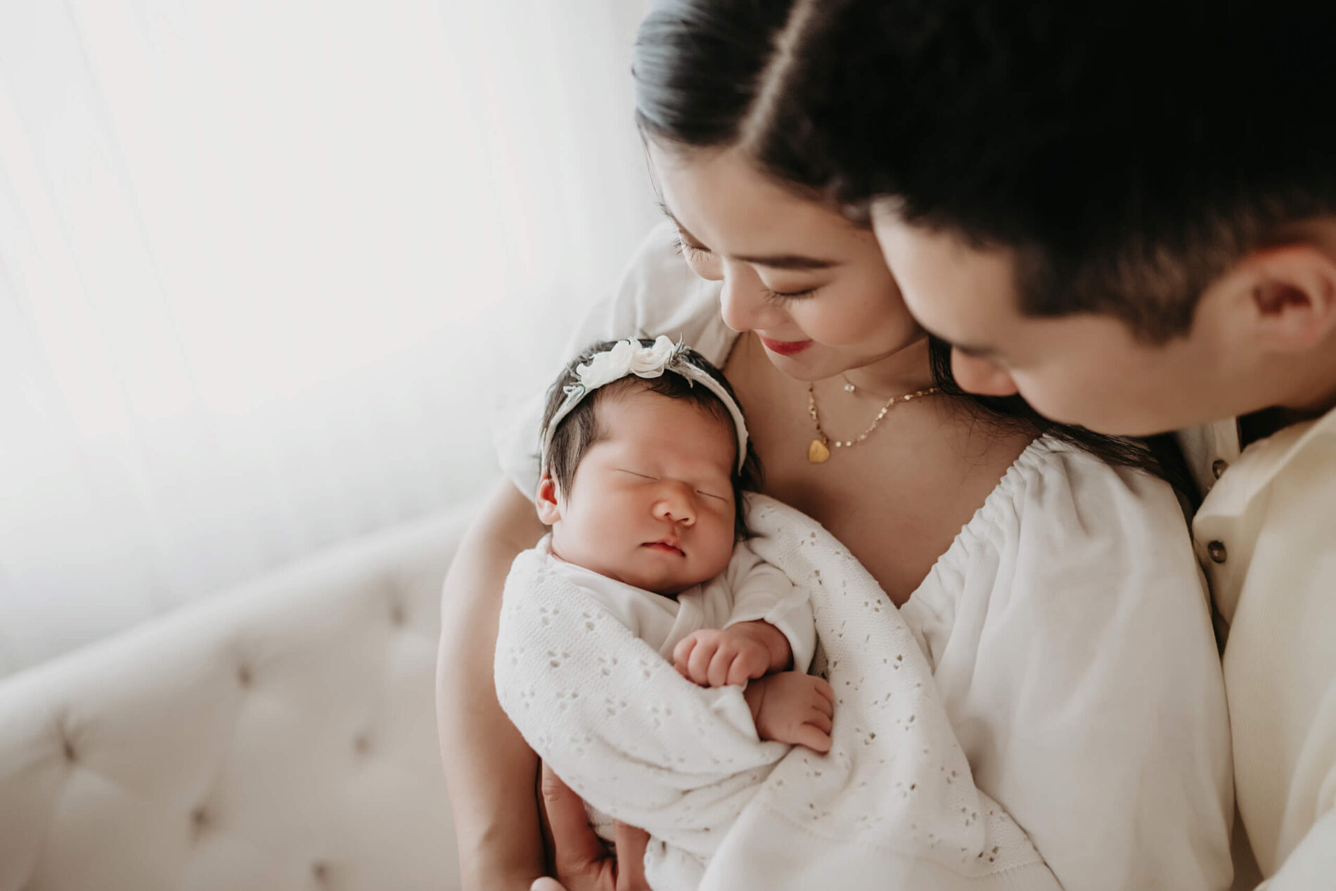 Newborn photography of baby girl with parents