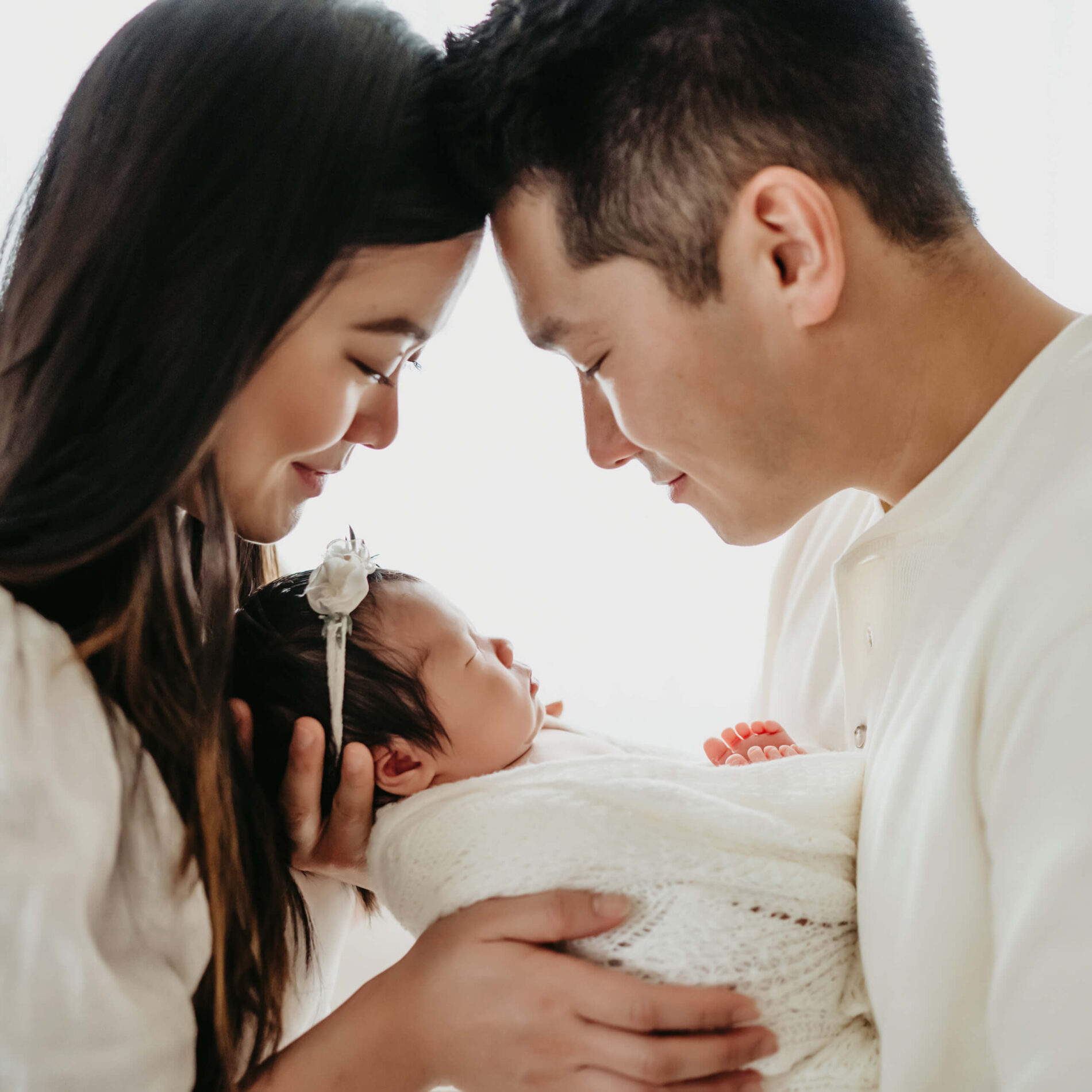 Newborn baby girl photo with parents