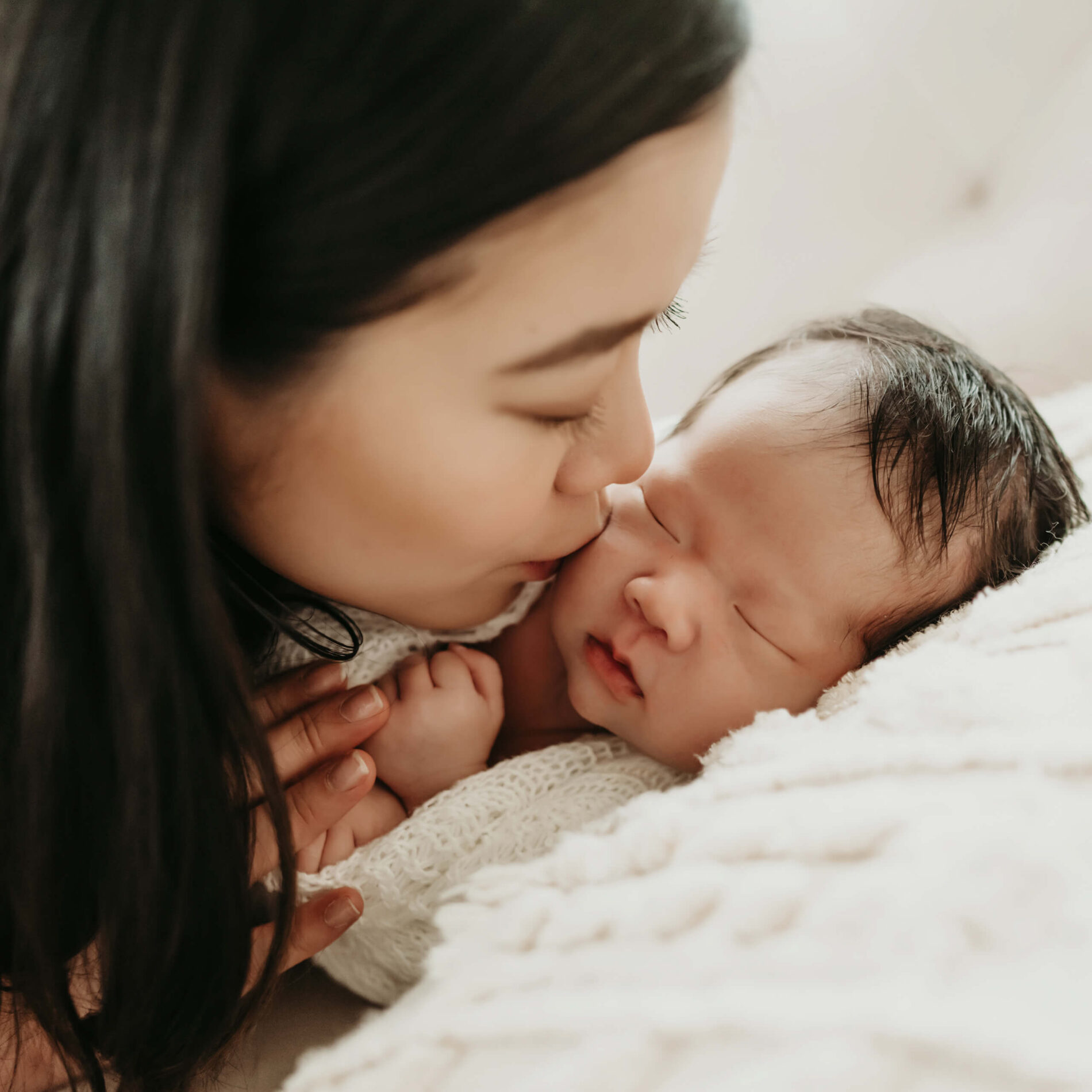 Mom and newborn photo in a studio