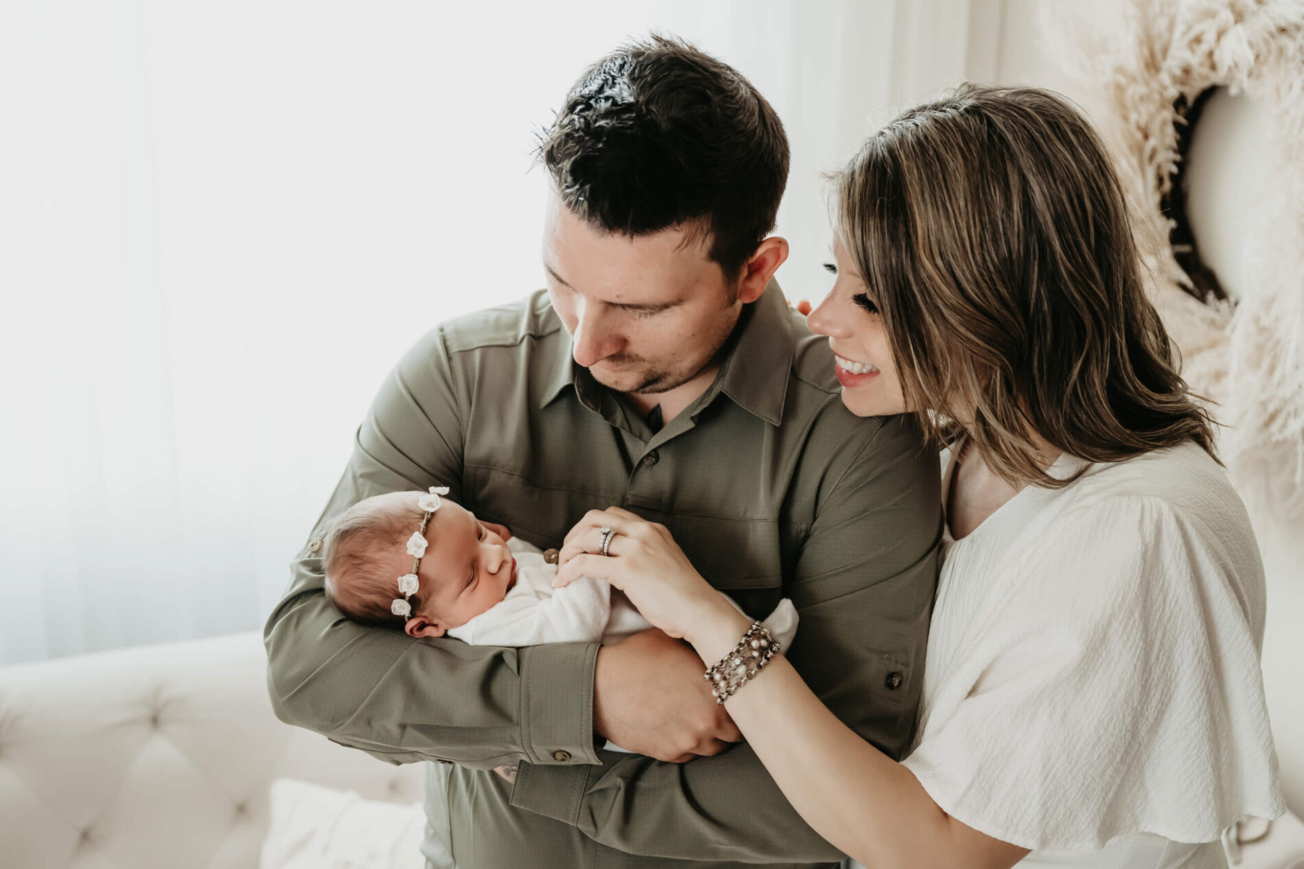 Unique newborn photography with parents in a Seattle studio