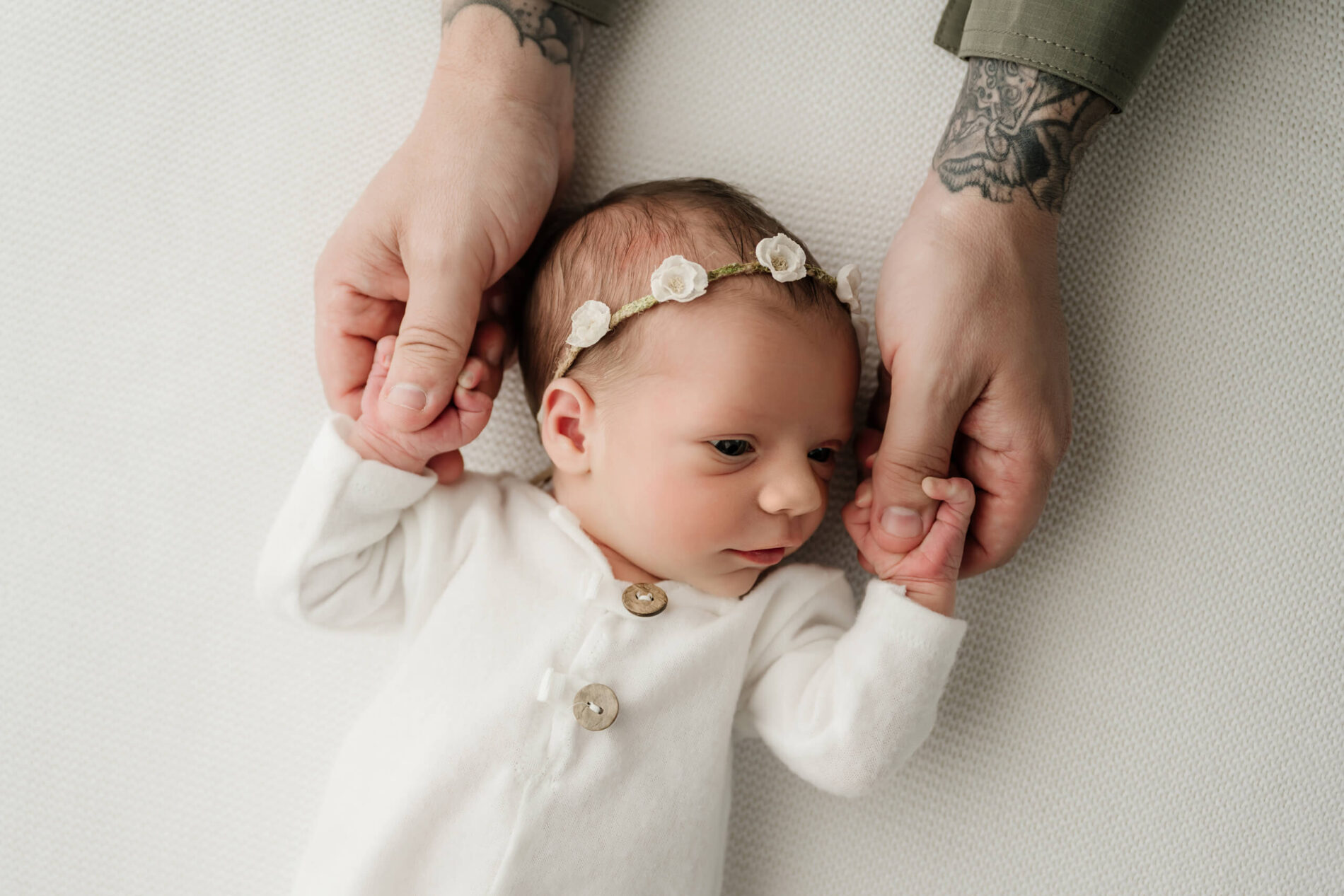 Unique newborn photography with dad in a Seattle area studio