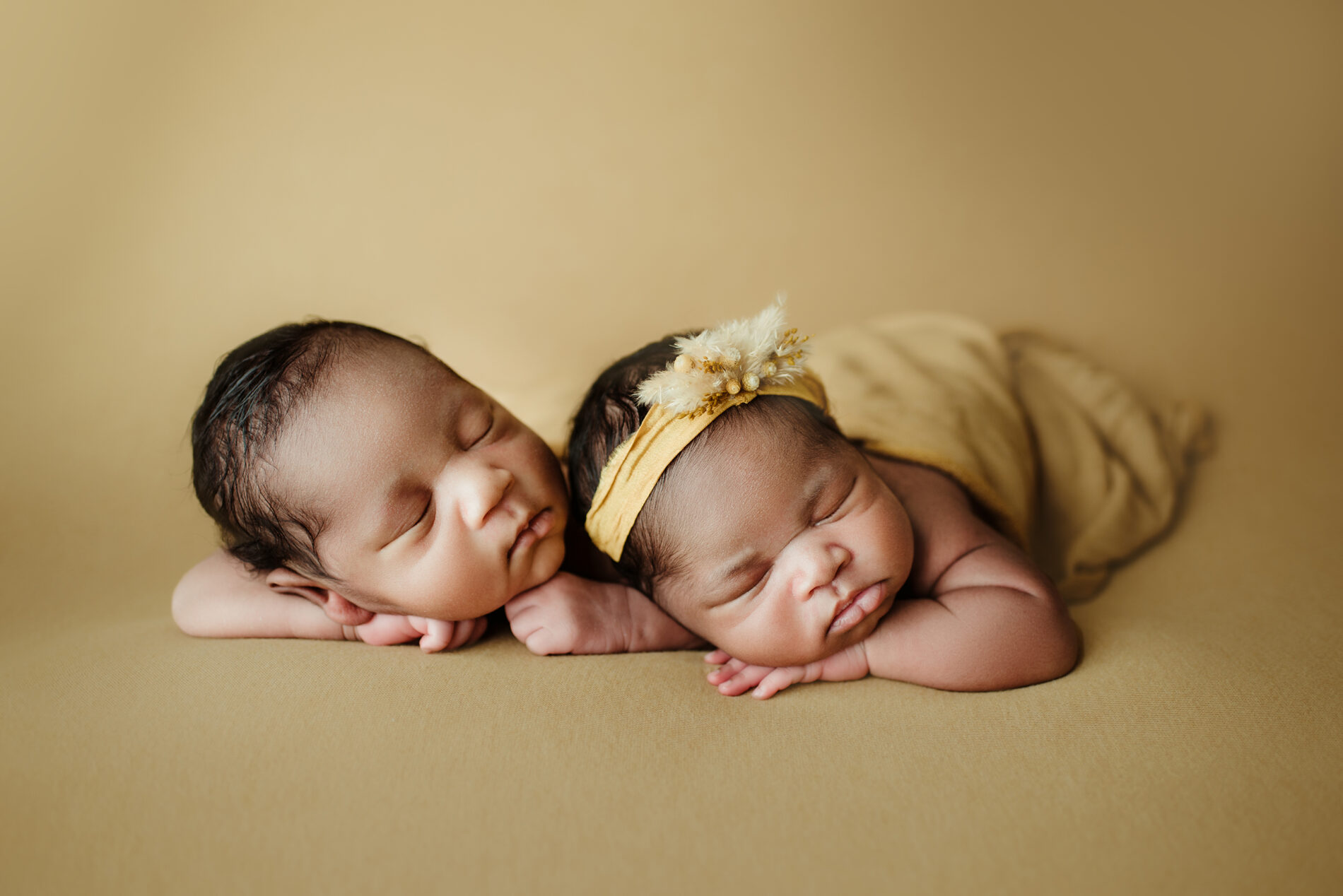 Twin newborn photo idea in a studio