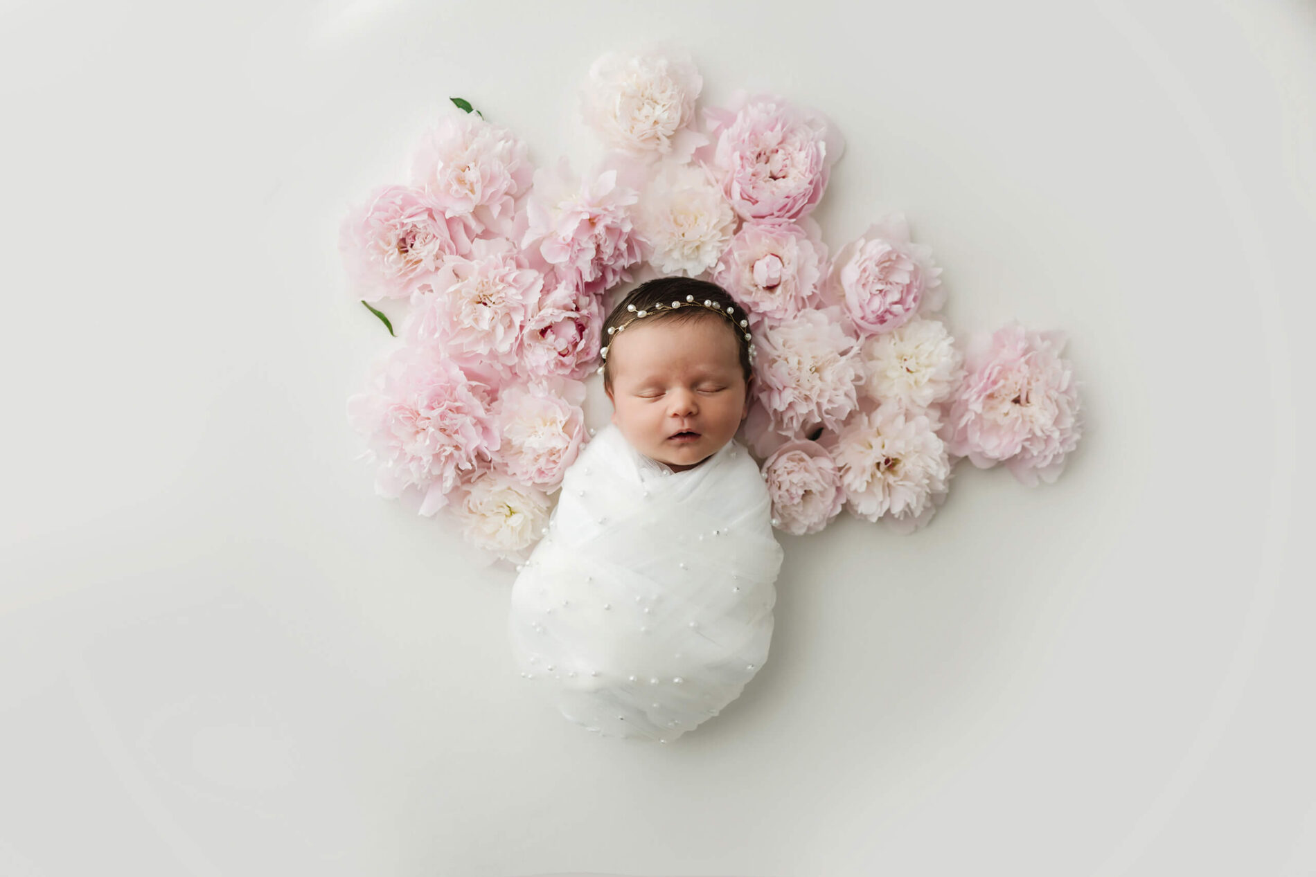 Unique newborn photo with flowers