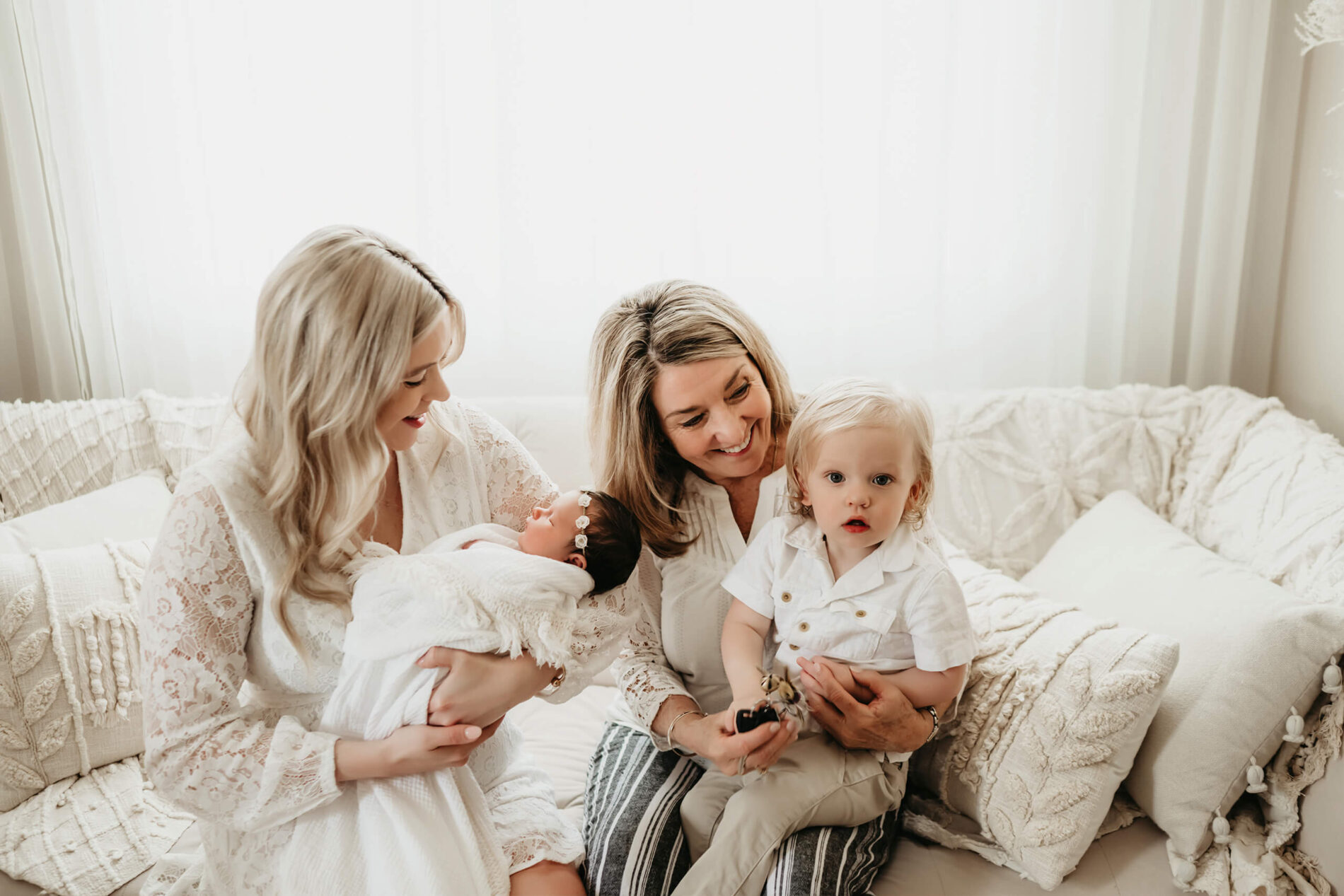 Unique family newborn photo with mom, toddler and grandma