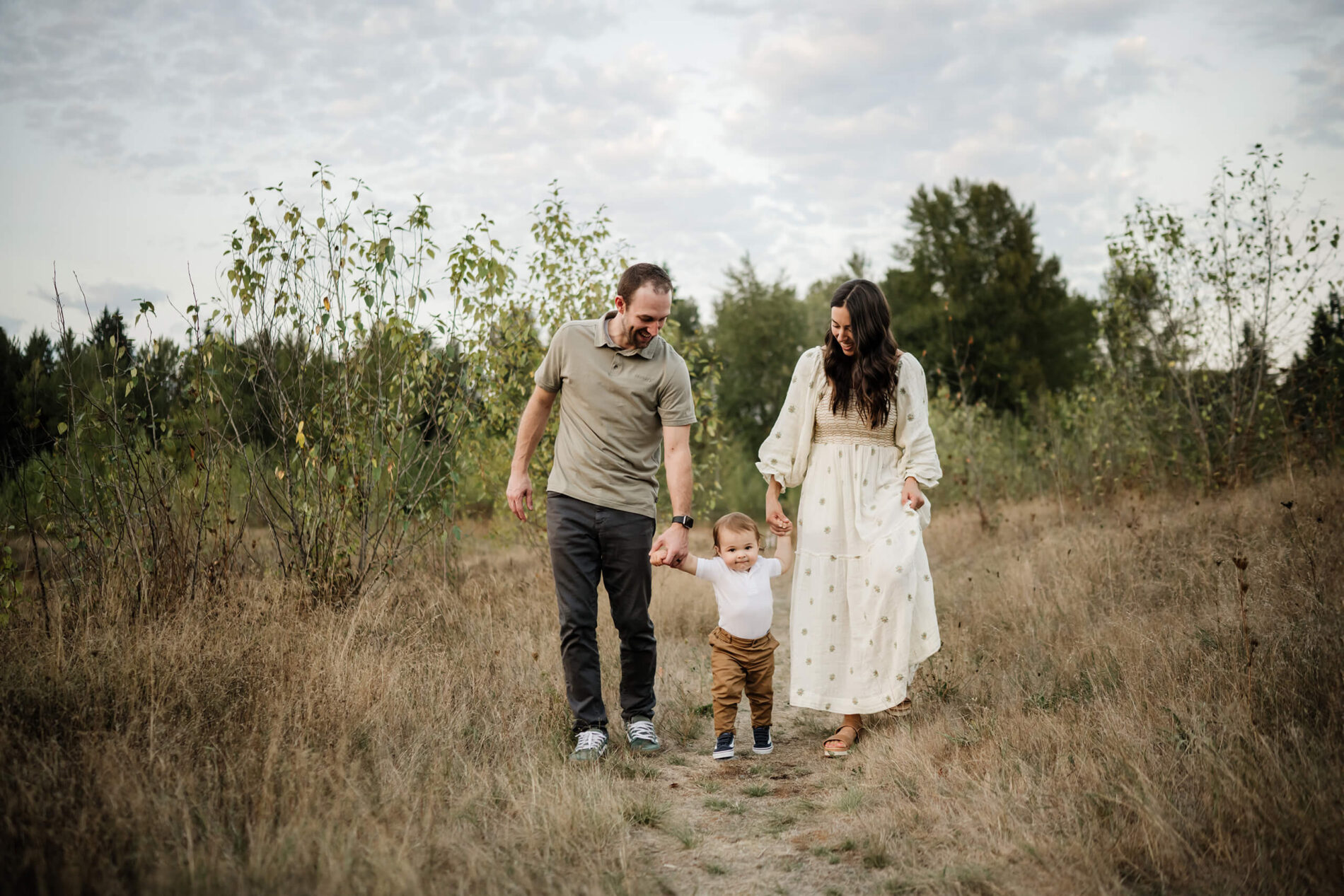 Lifestyle family photos in Redmond WA with mom, dad, and toddler boy