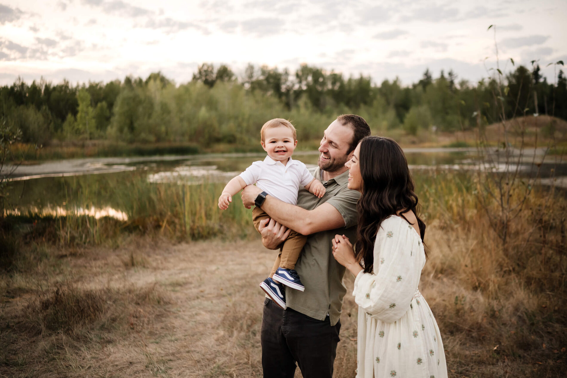 Family posing for photos in a field in Redmond WA