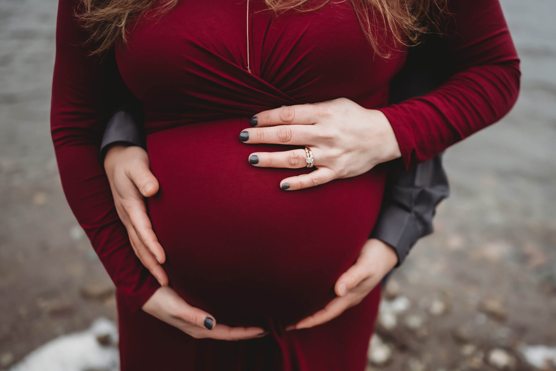 A moment during a winter maternity photoshoot