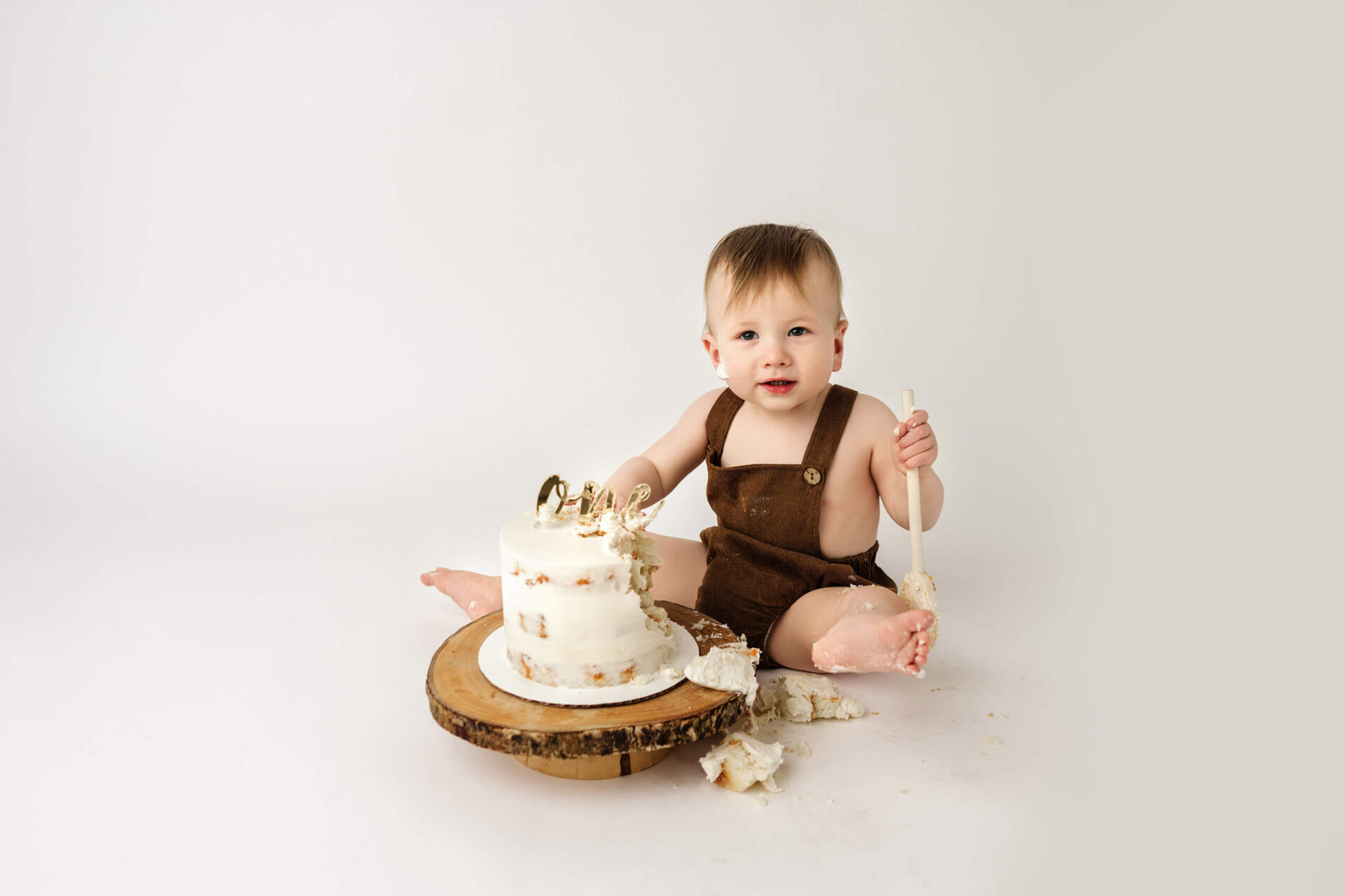 A moment during a cake smash session in a Seattle area studio