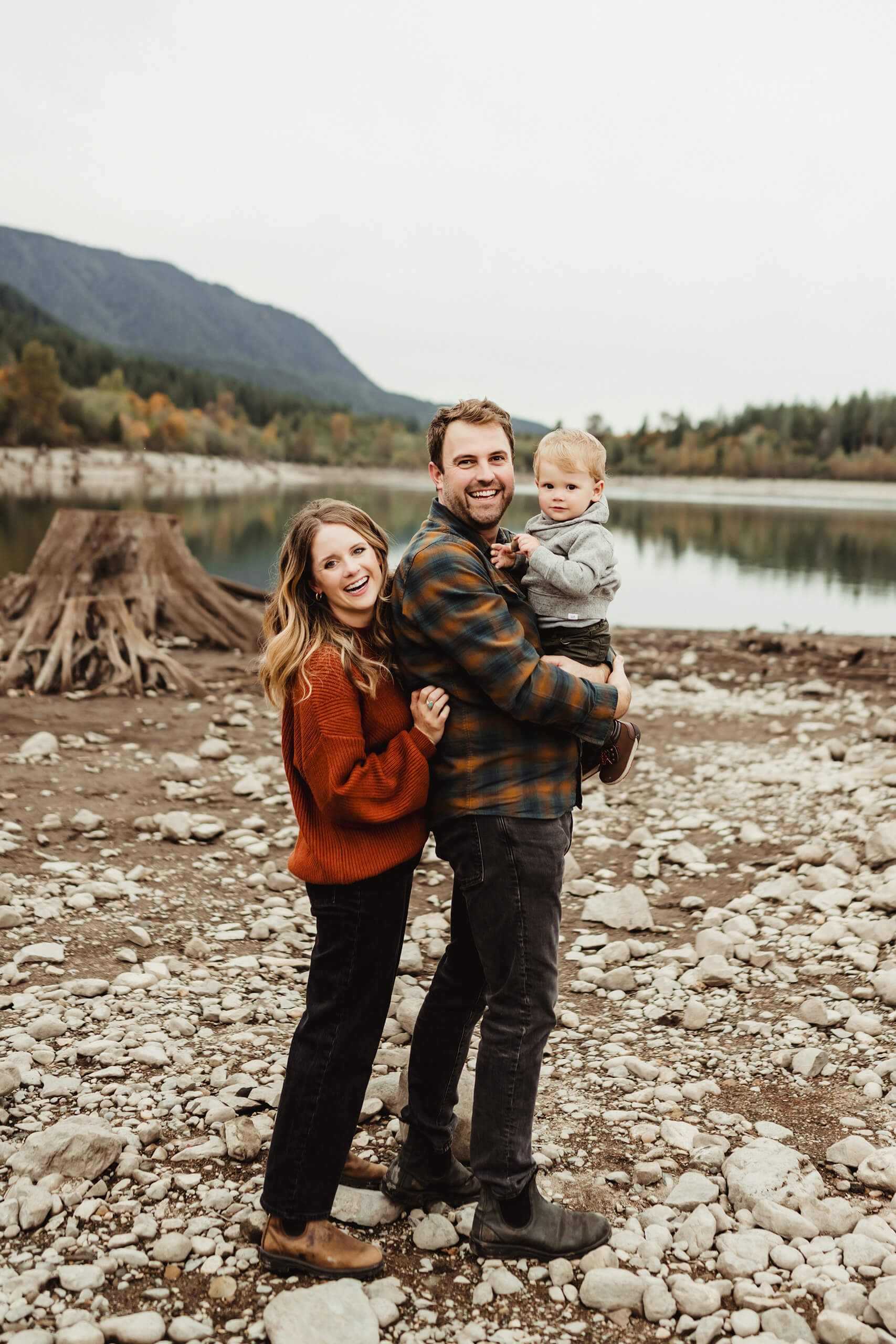 A family posing during a photo shoot in the Cascade mountains in the fall