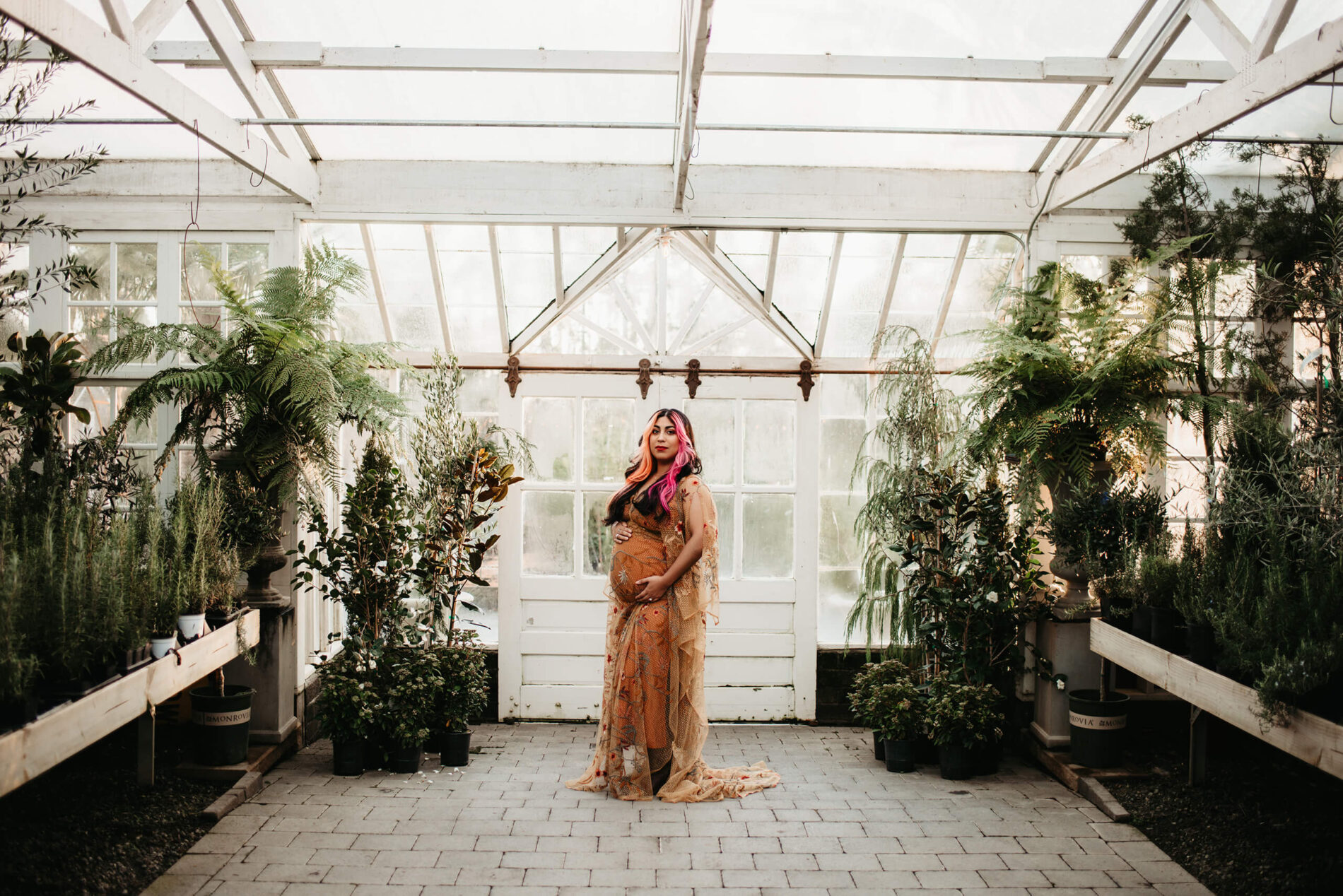 A woman posing during a winter pregnancy photo shoot