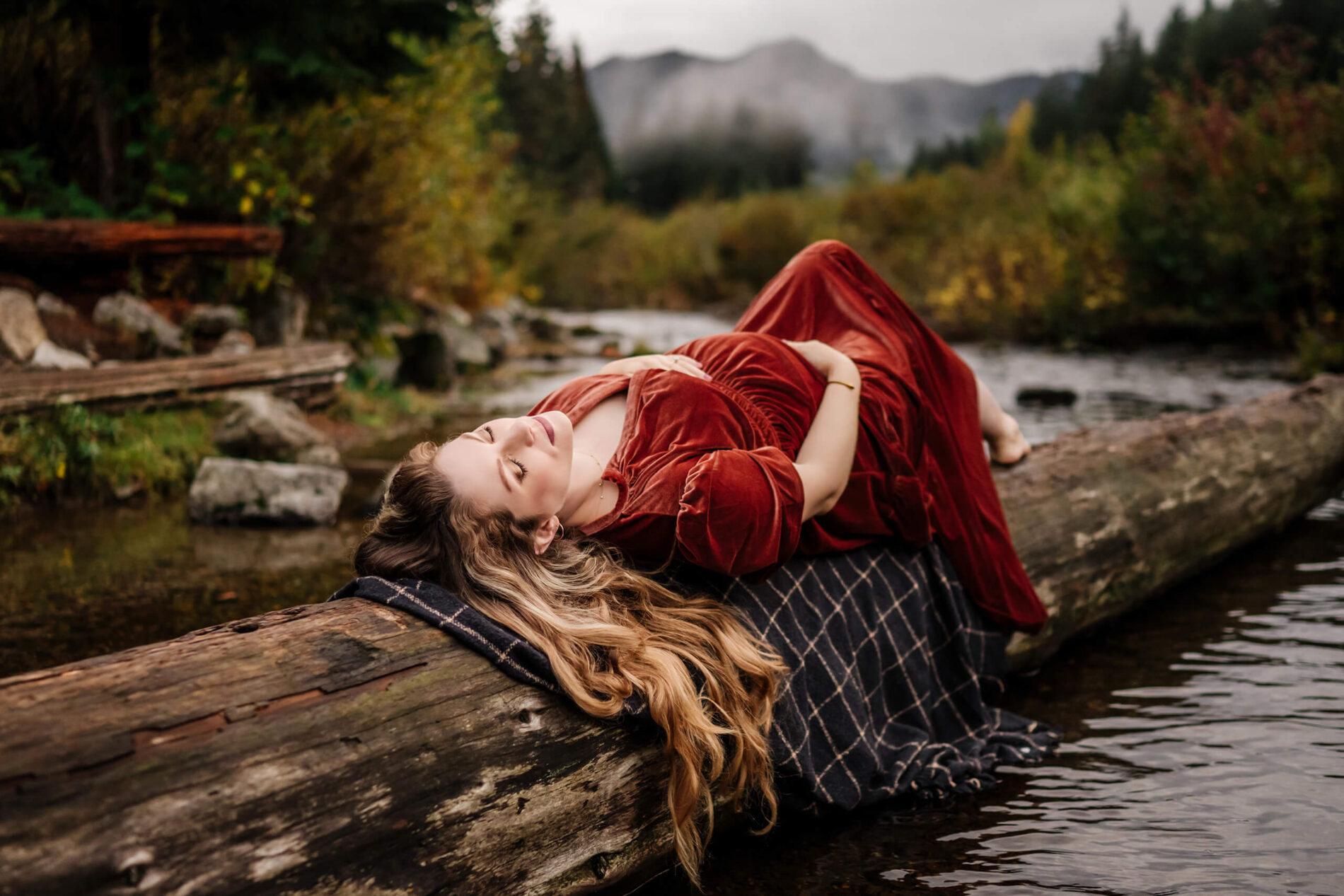 Woman in a dress during a pregnancy photo shoot in the Cascades