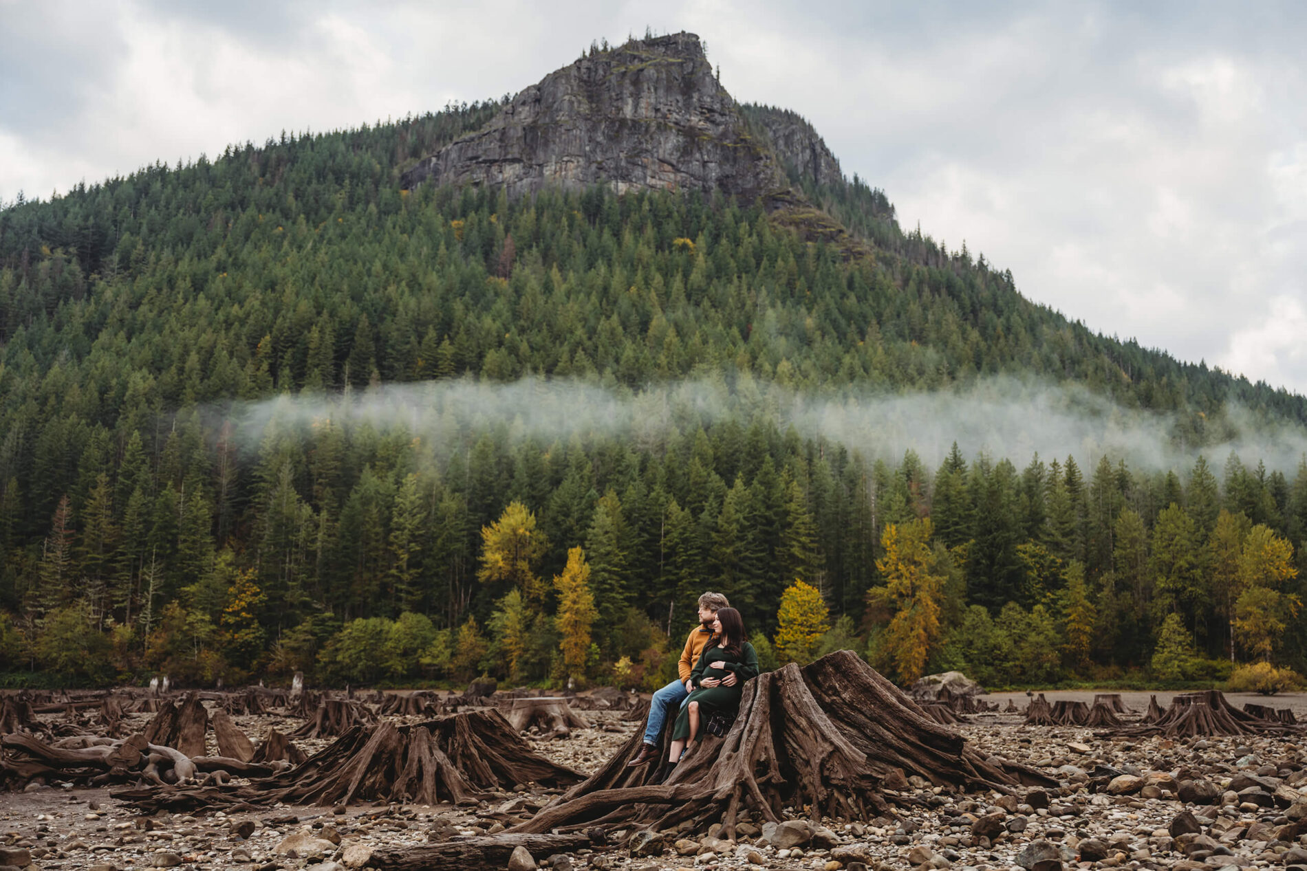 Couples maternity shoot in the Seattle area with mountains in the background