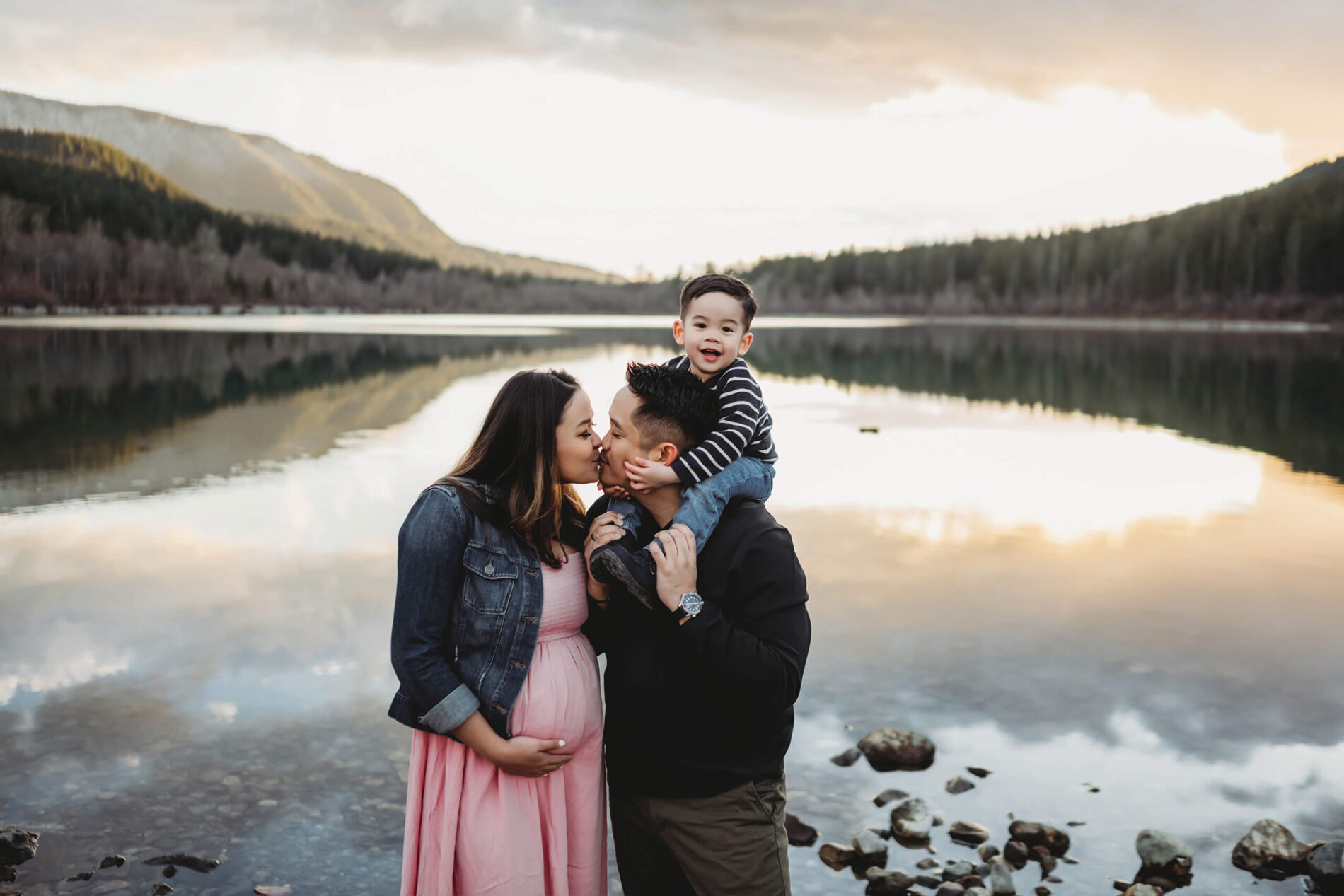 A maternity shoot with a toddler in the Seattle area with mountains and lake in the background