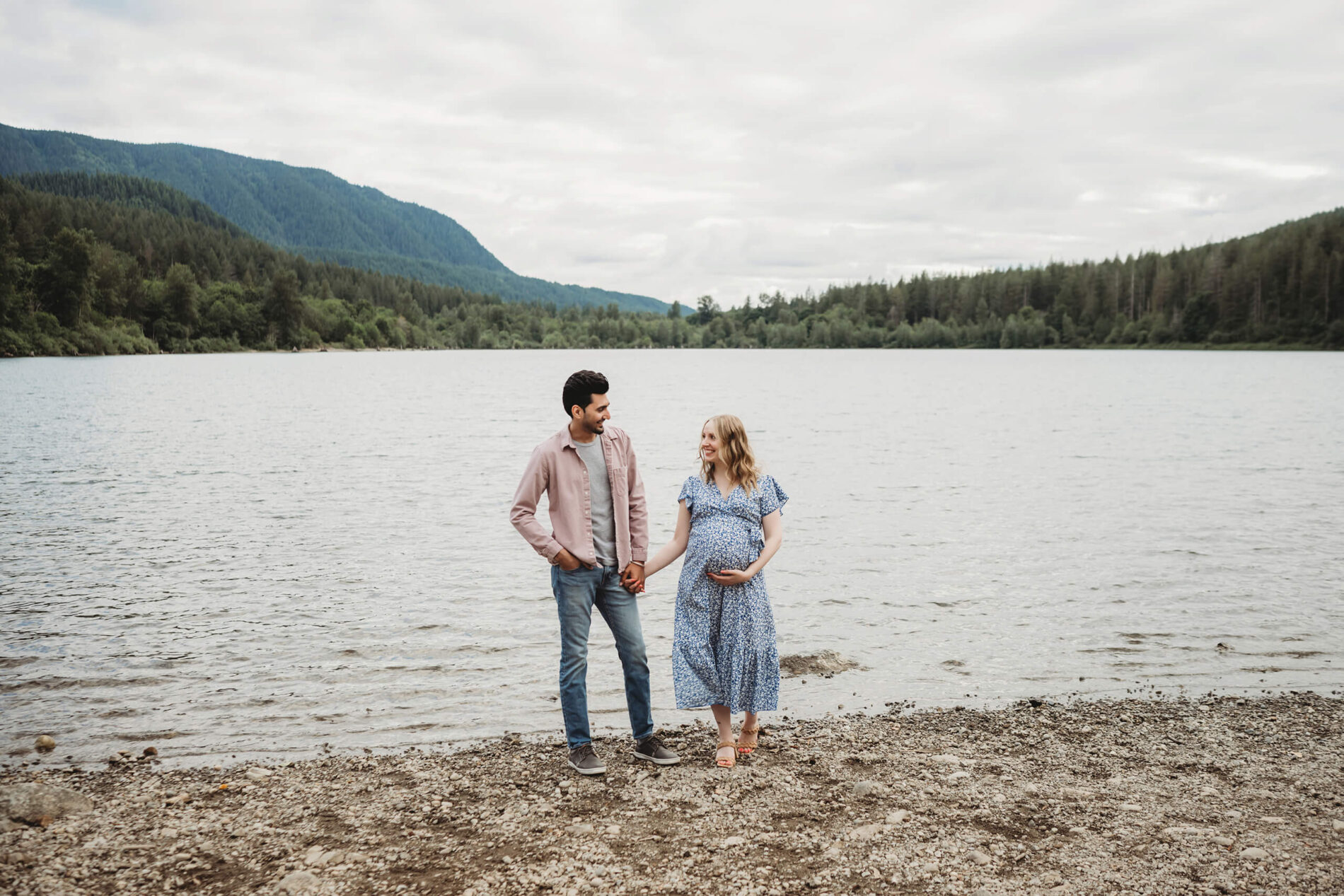 Couple posing during an outdoor maternity photo shoot in the Seattle area