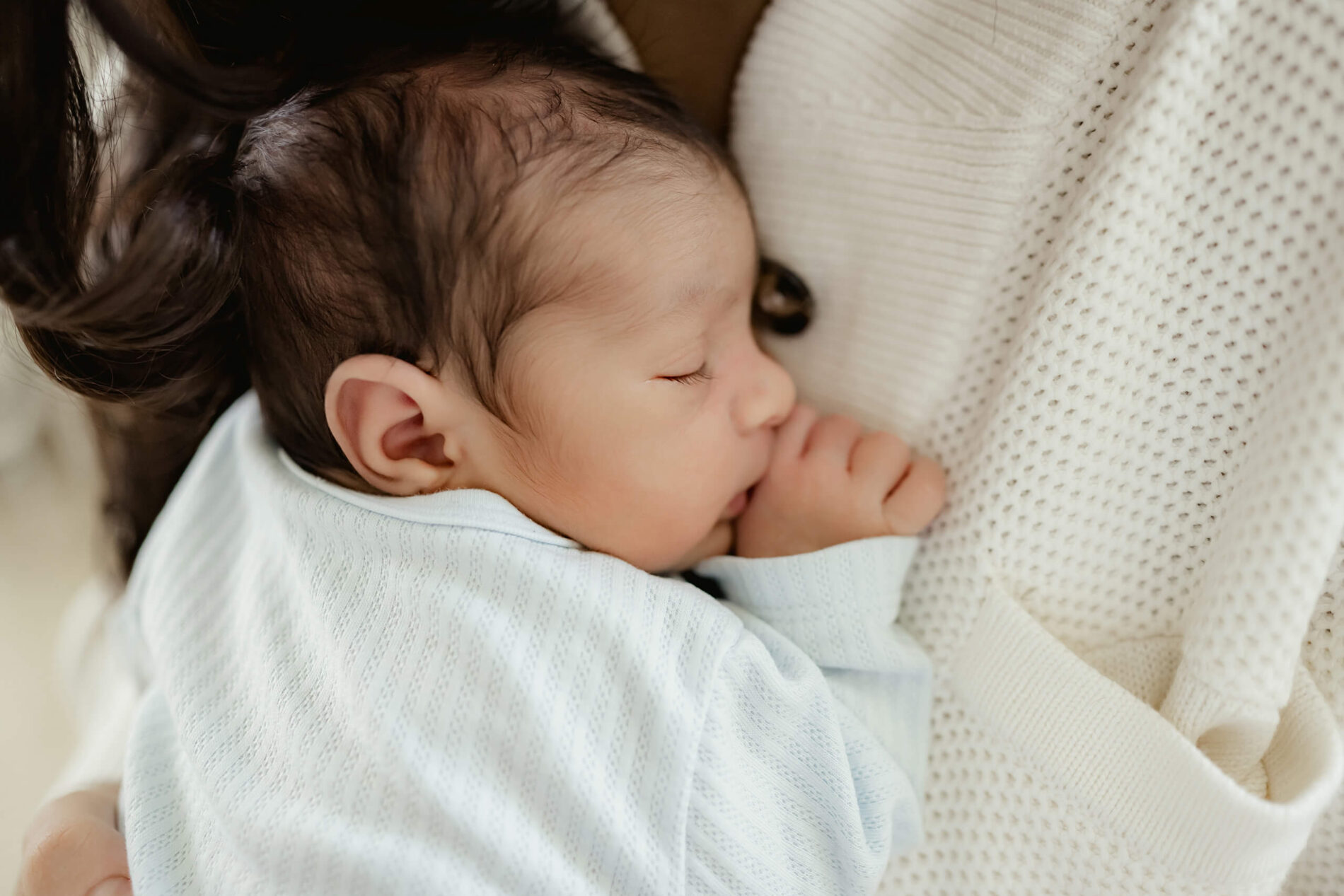 Newborn photography, focus on bond between mom and baby