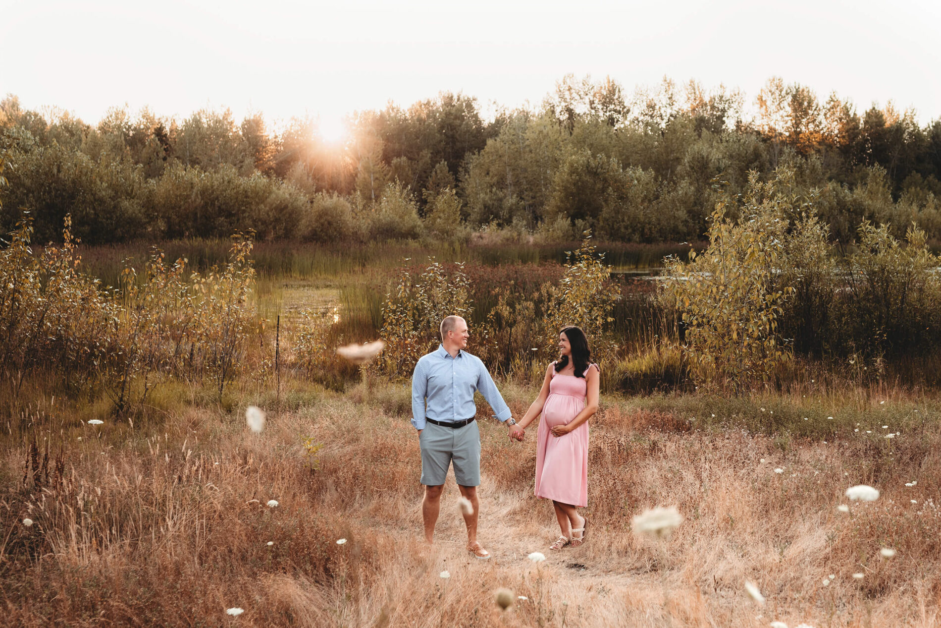 Couple posing during maternity photo shoot in Redmond