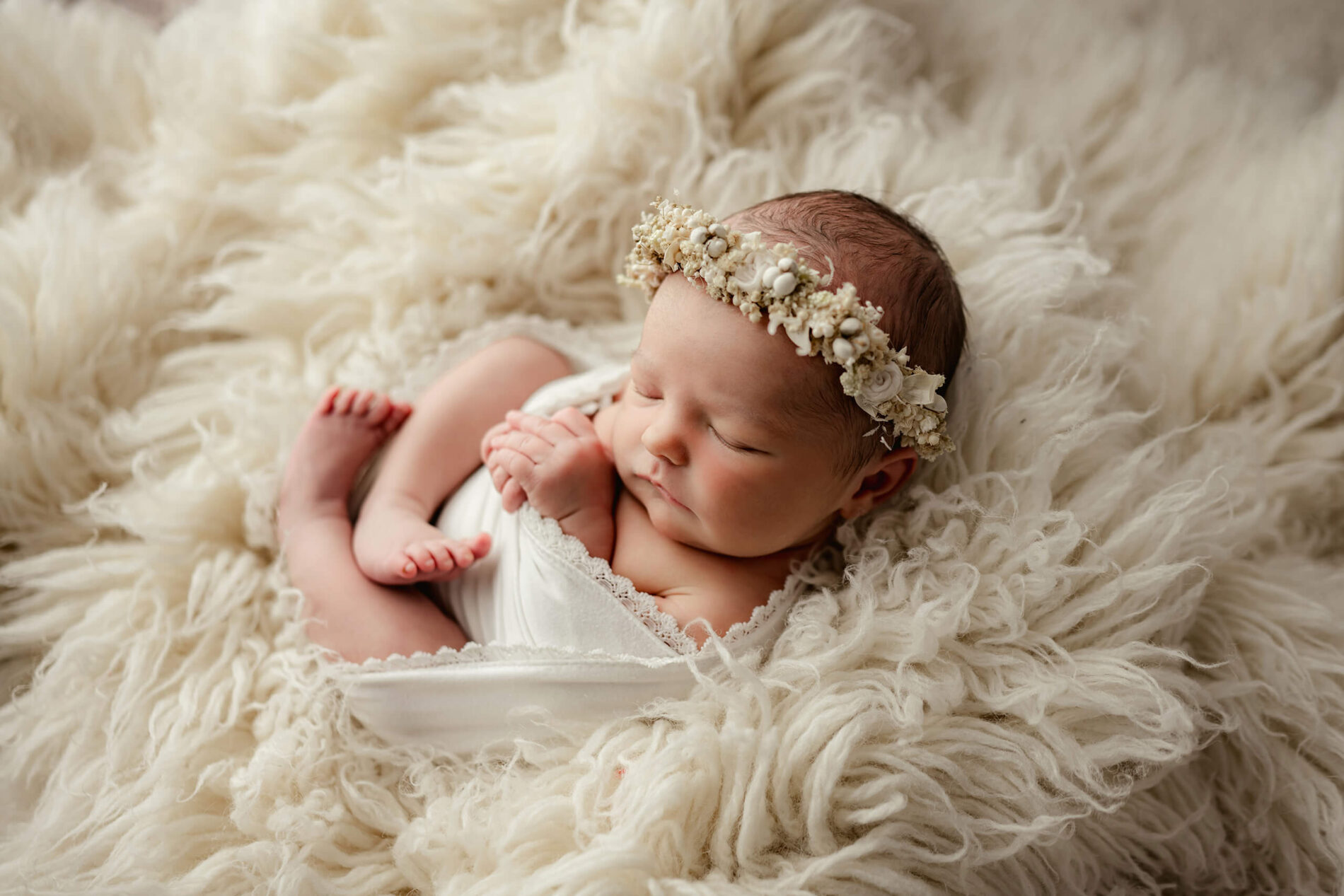 Unique newborn photo shoot of baby girl with props