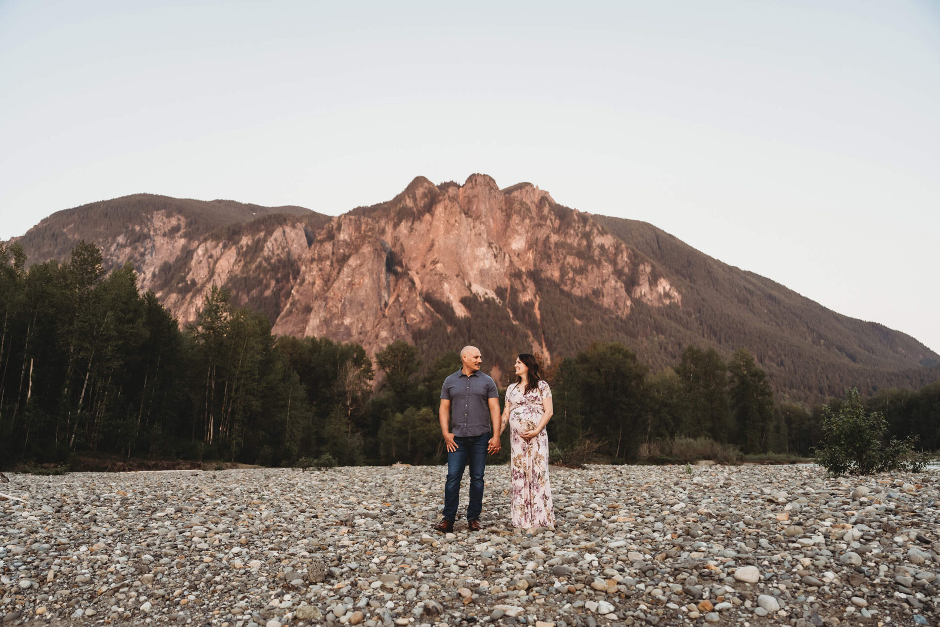 Posing idea for couples during outdoor maternity sessions
