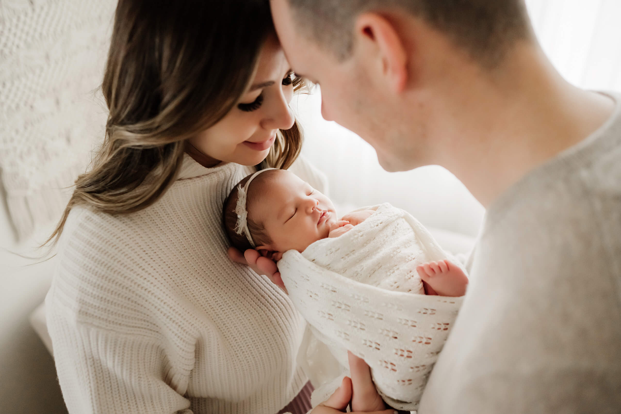 Seattle newborn photography, baby girl held by mom and dad