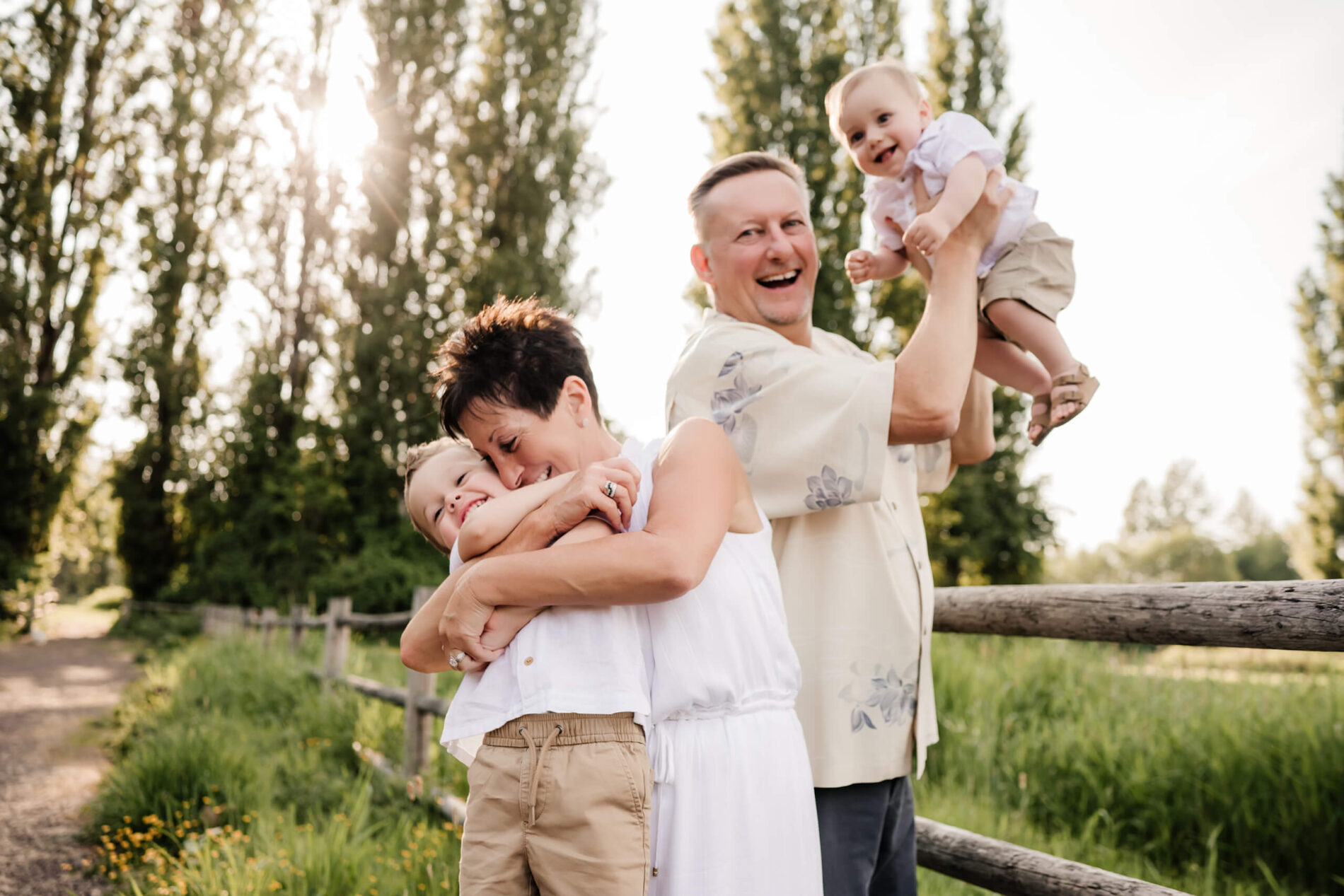 Bellevue area lifestyle family photoshoot with grandparents, grandpa and grandma playing with two grandsons