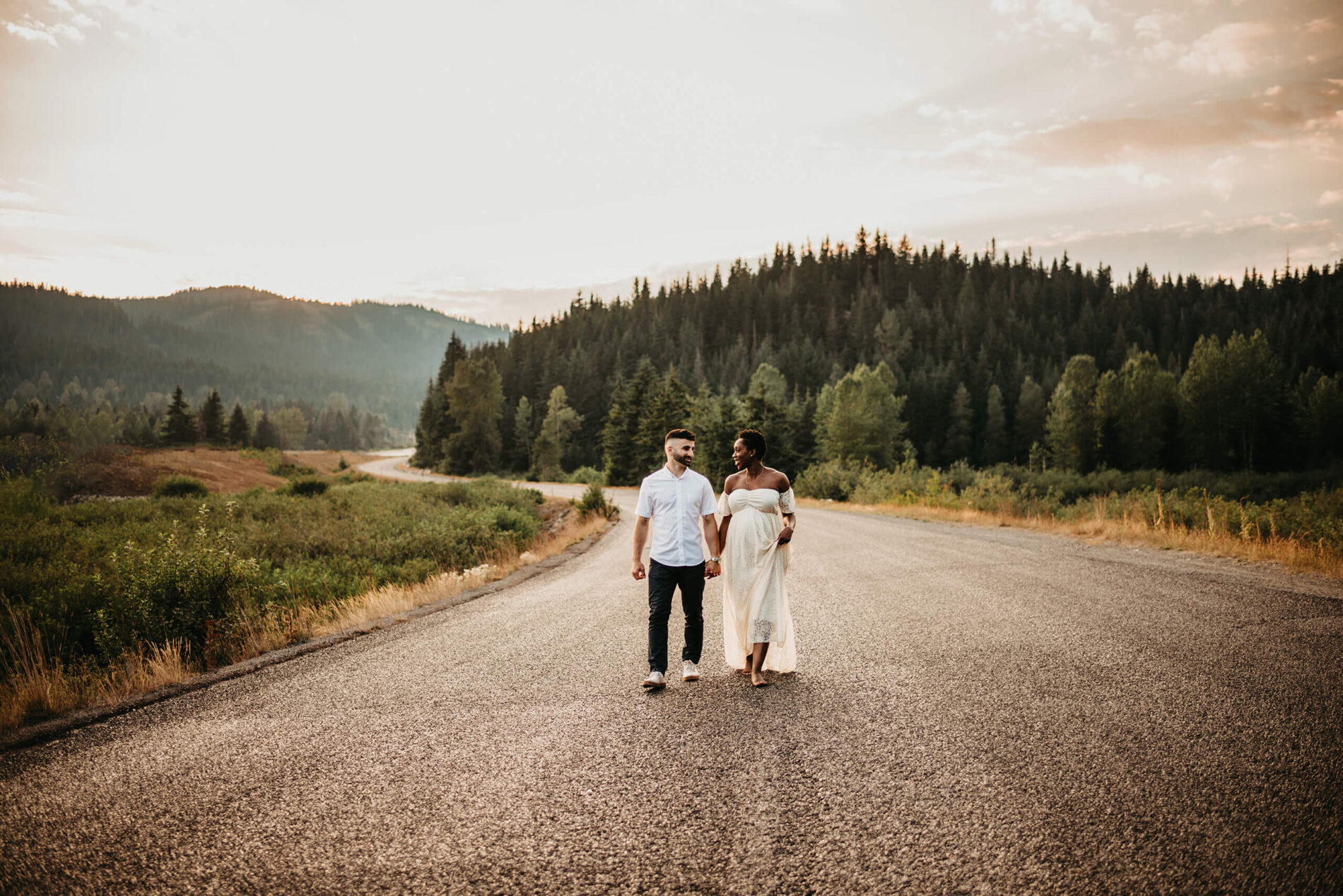 Seattle maternity photography with mountain backdrop, young couple posed during a pregnancy photoshoot