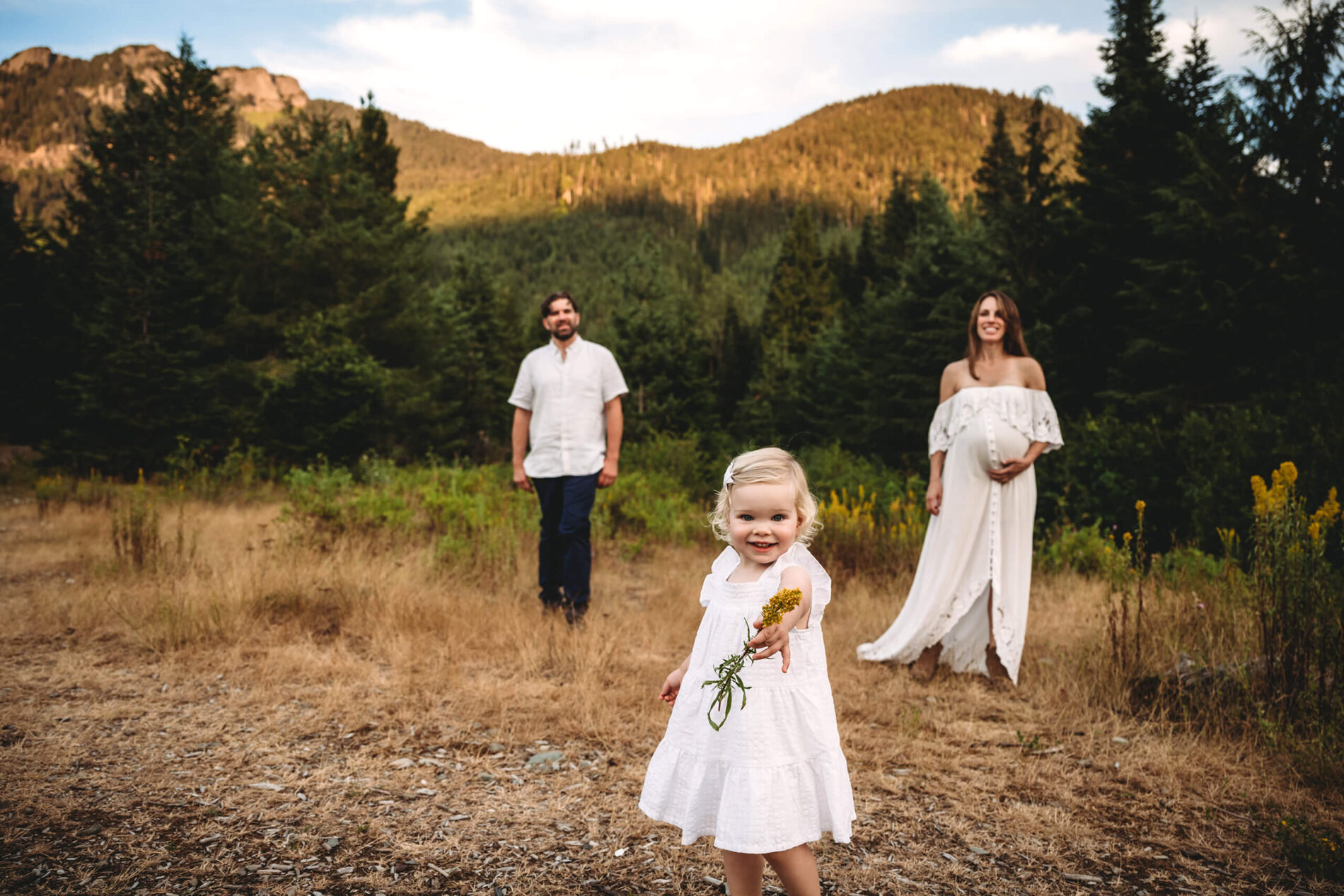 Natural posing idea for maternity photo with a toddler in Seattle