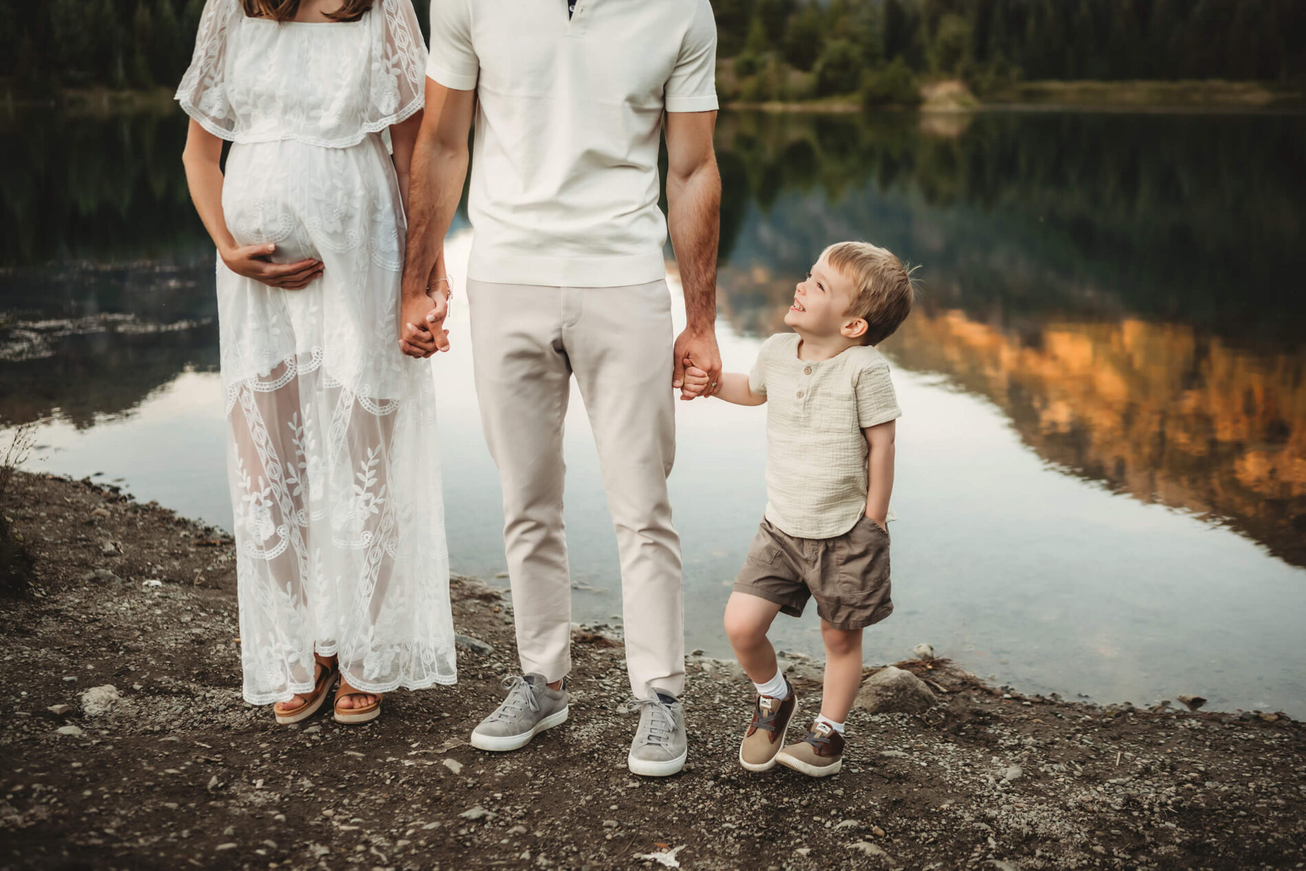 Posing idea for a natural maternity photoshoot with a sibling in Seattle