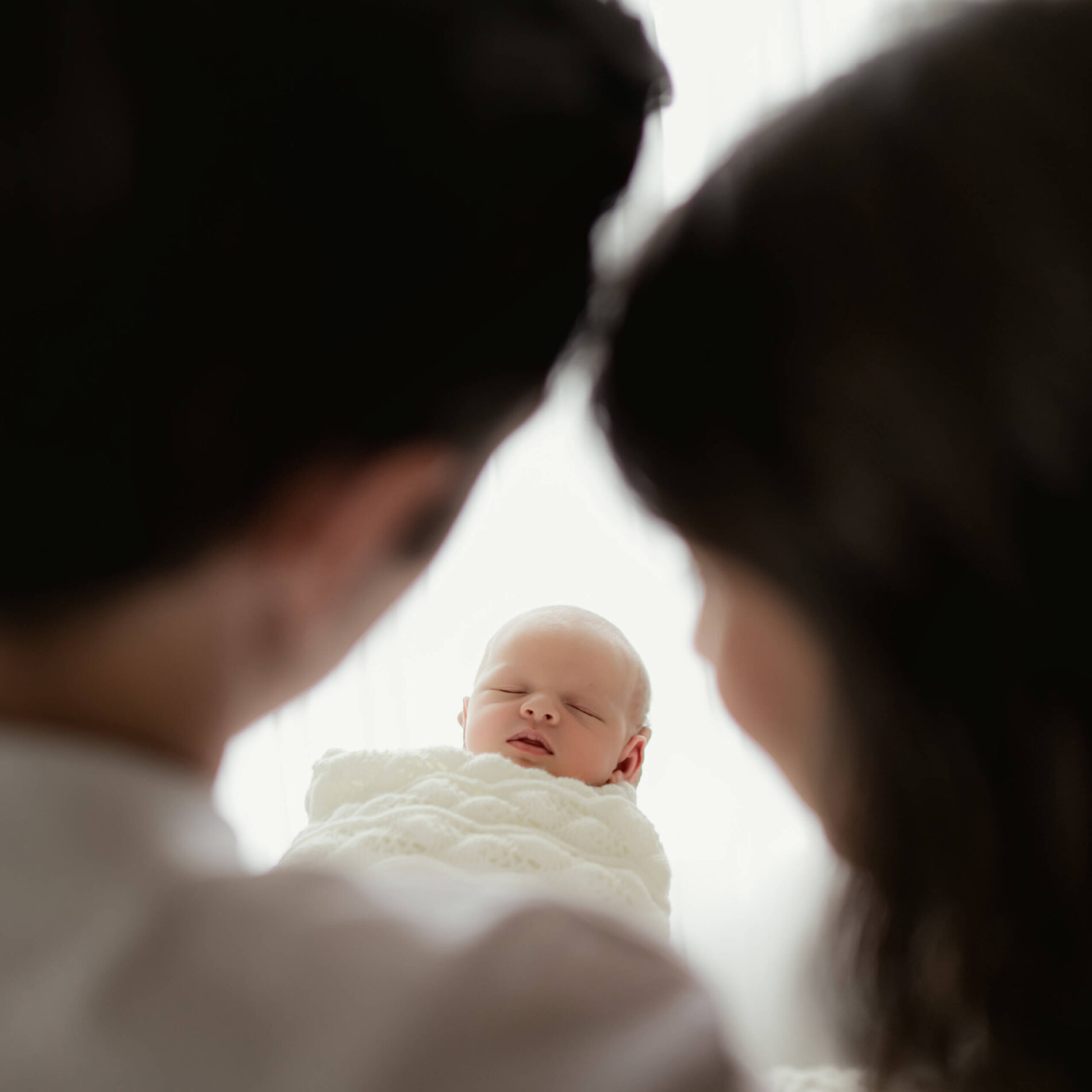 Unique posing idea during newborn photo session in Seattle studio