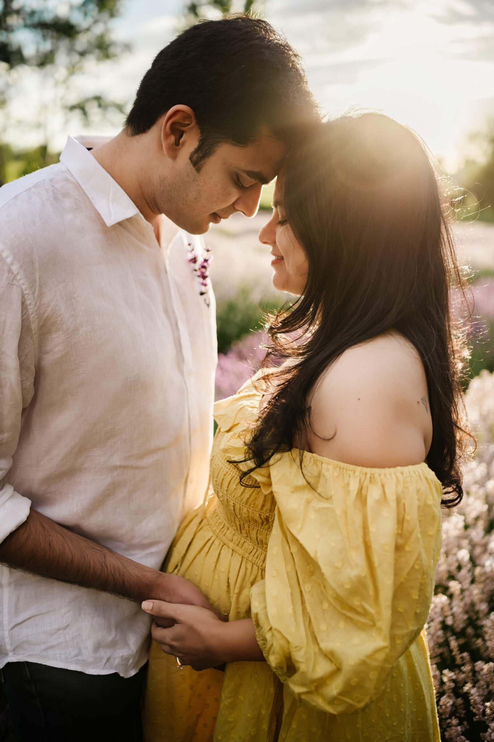 Couple hugging during pregnancy photoshoot in Seattle area