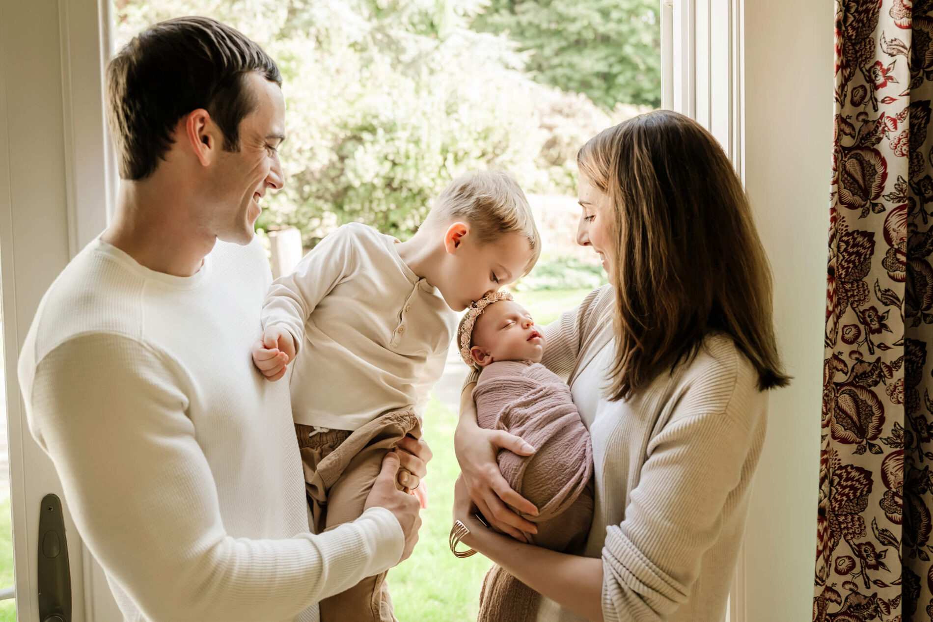 Family of four with a newborn photographed at a Seattle home