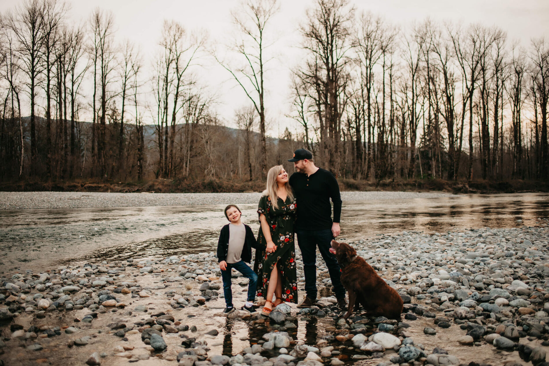 Seattle family of three photography with a dog with river and mountains in the background