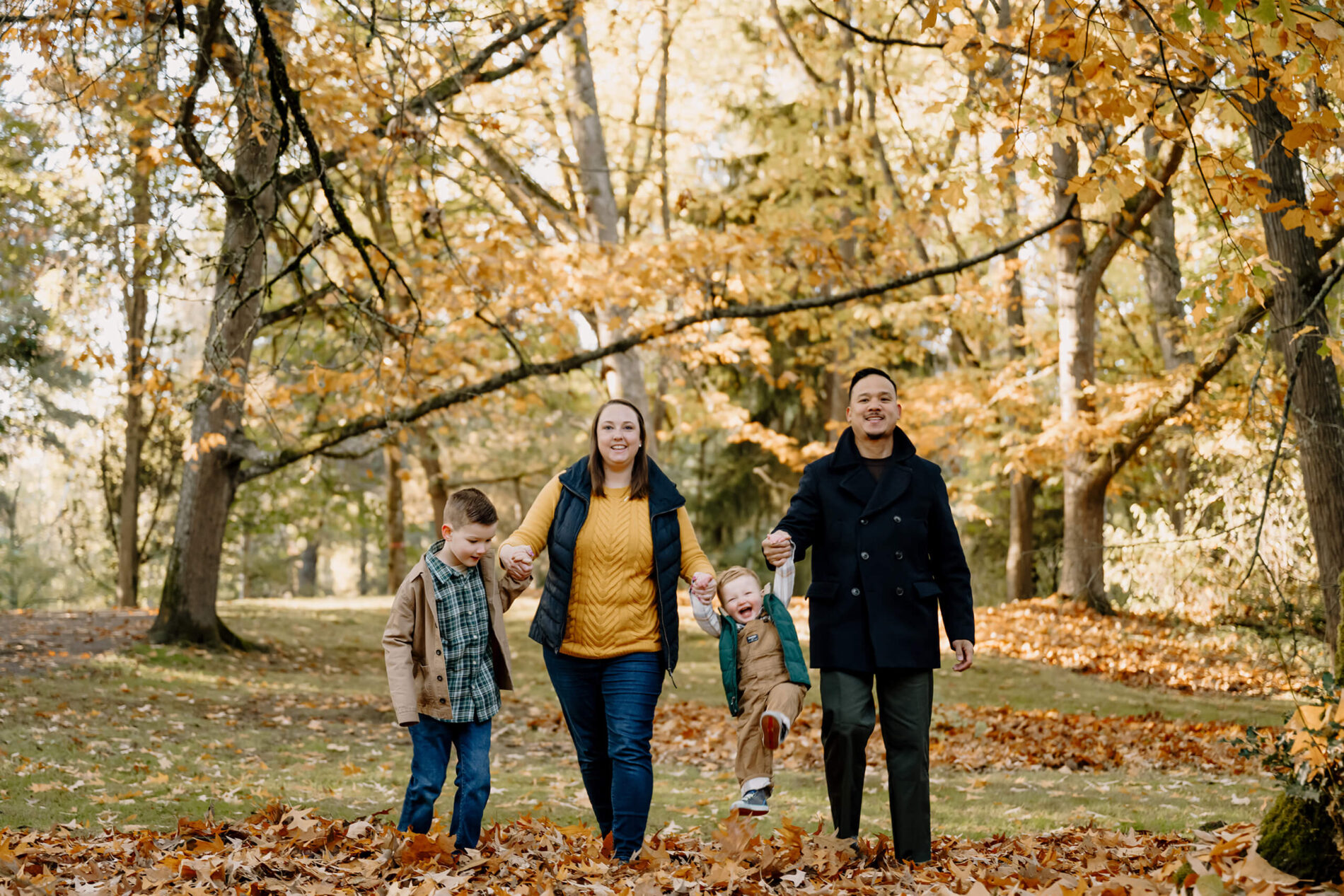 Family of four posing during fall family photoshoot in Seattle