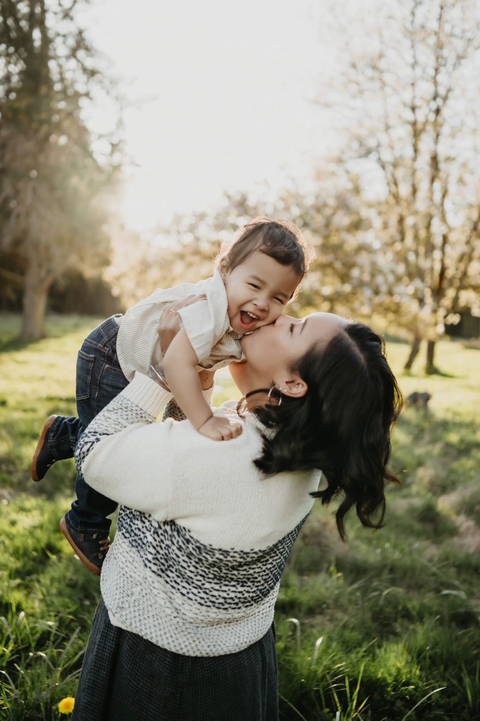 Mom playing with her son during family photoshoot in Seattle area