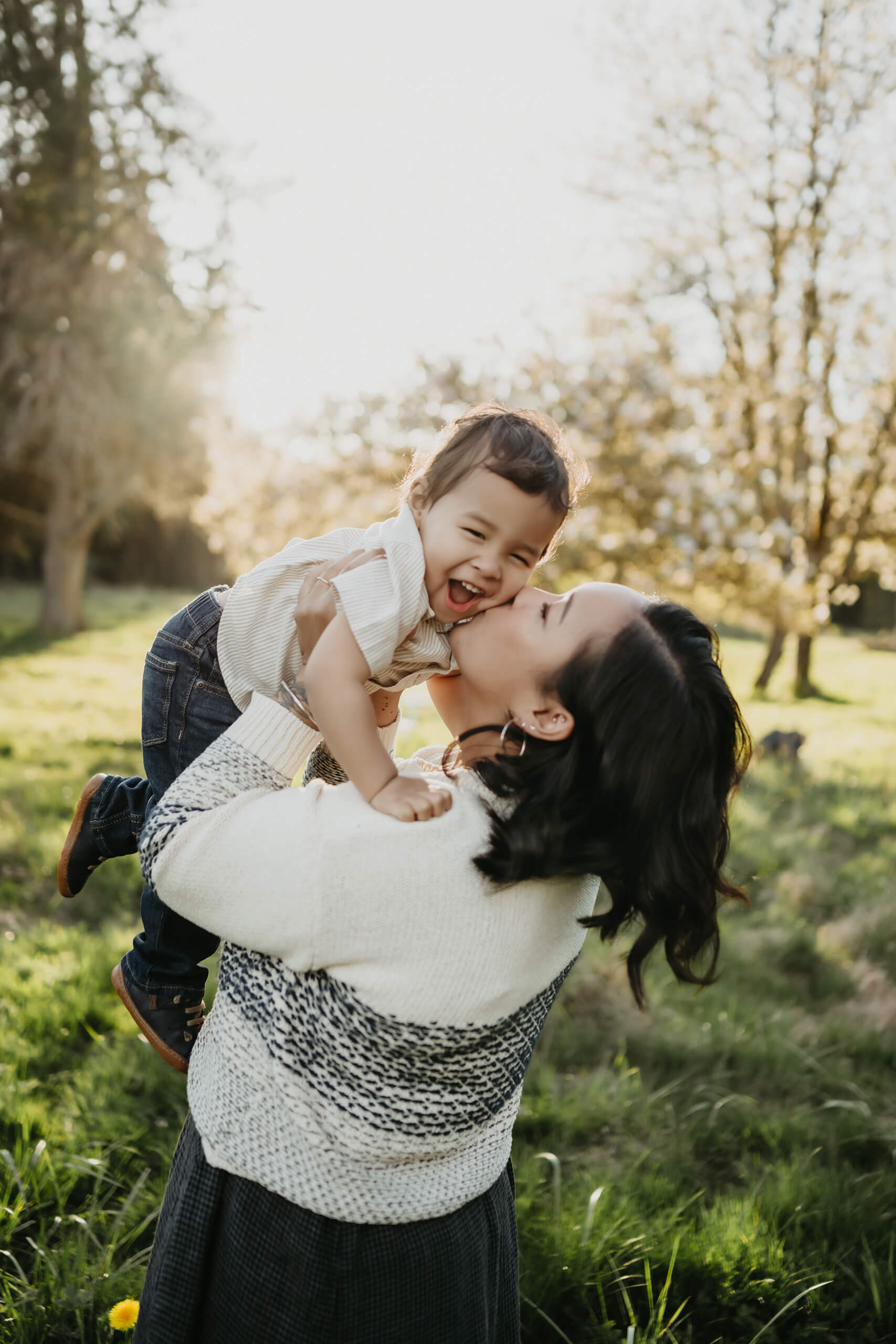 Mom playing with her son during family photoshoot in Seattle area
