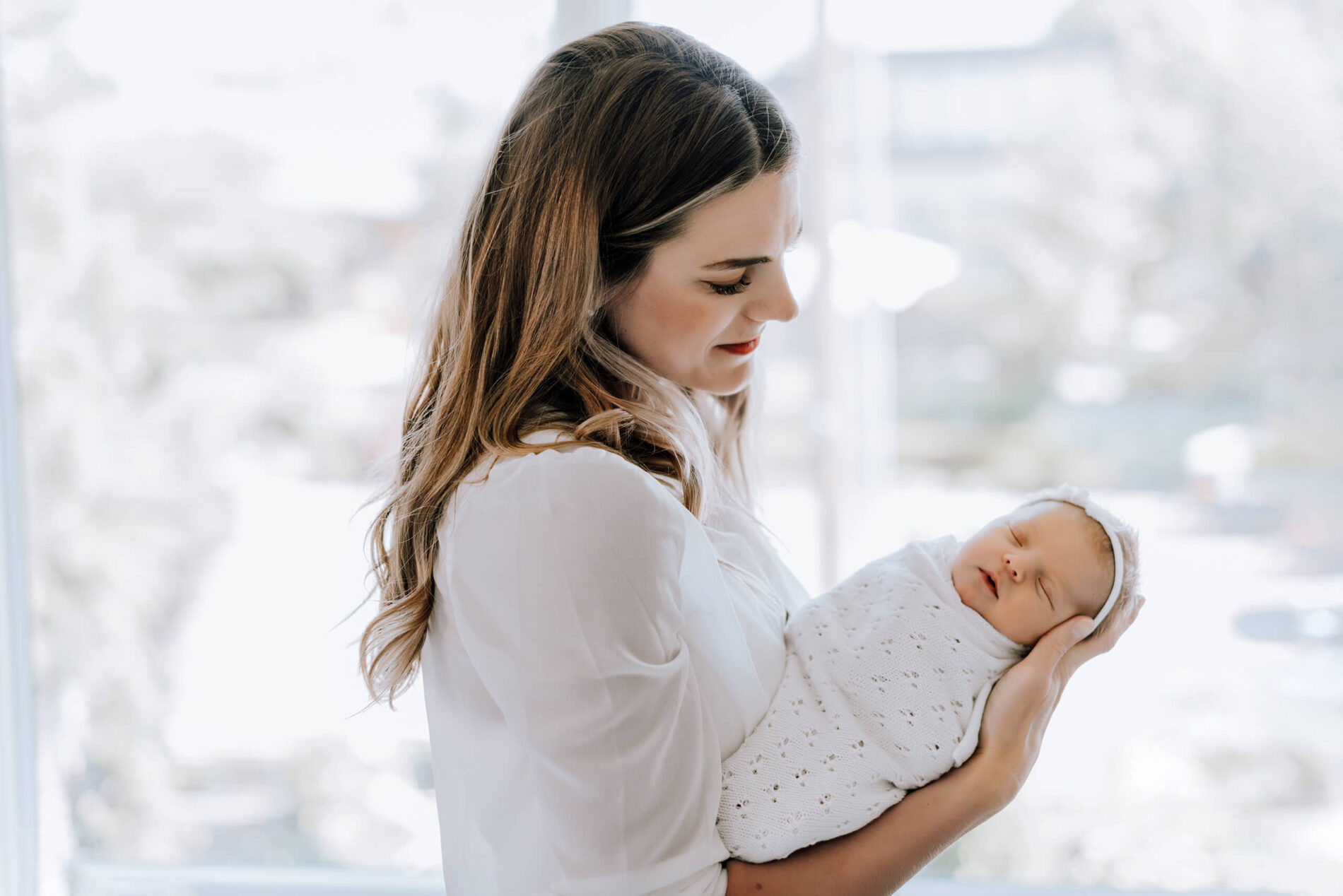 Infant photo with mom taken at a Seattle home