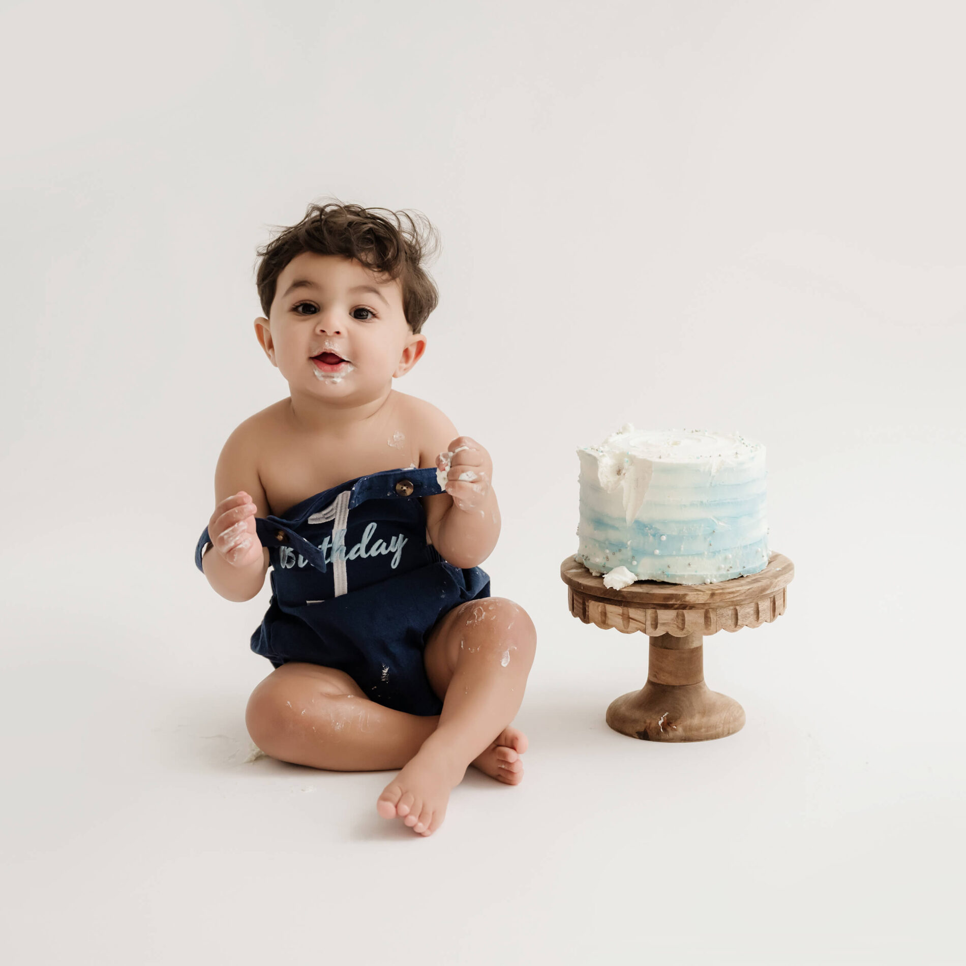 1st birthday cake smash photoshoot for a boy in a studio near Bellevue WA