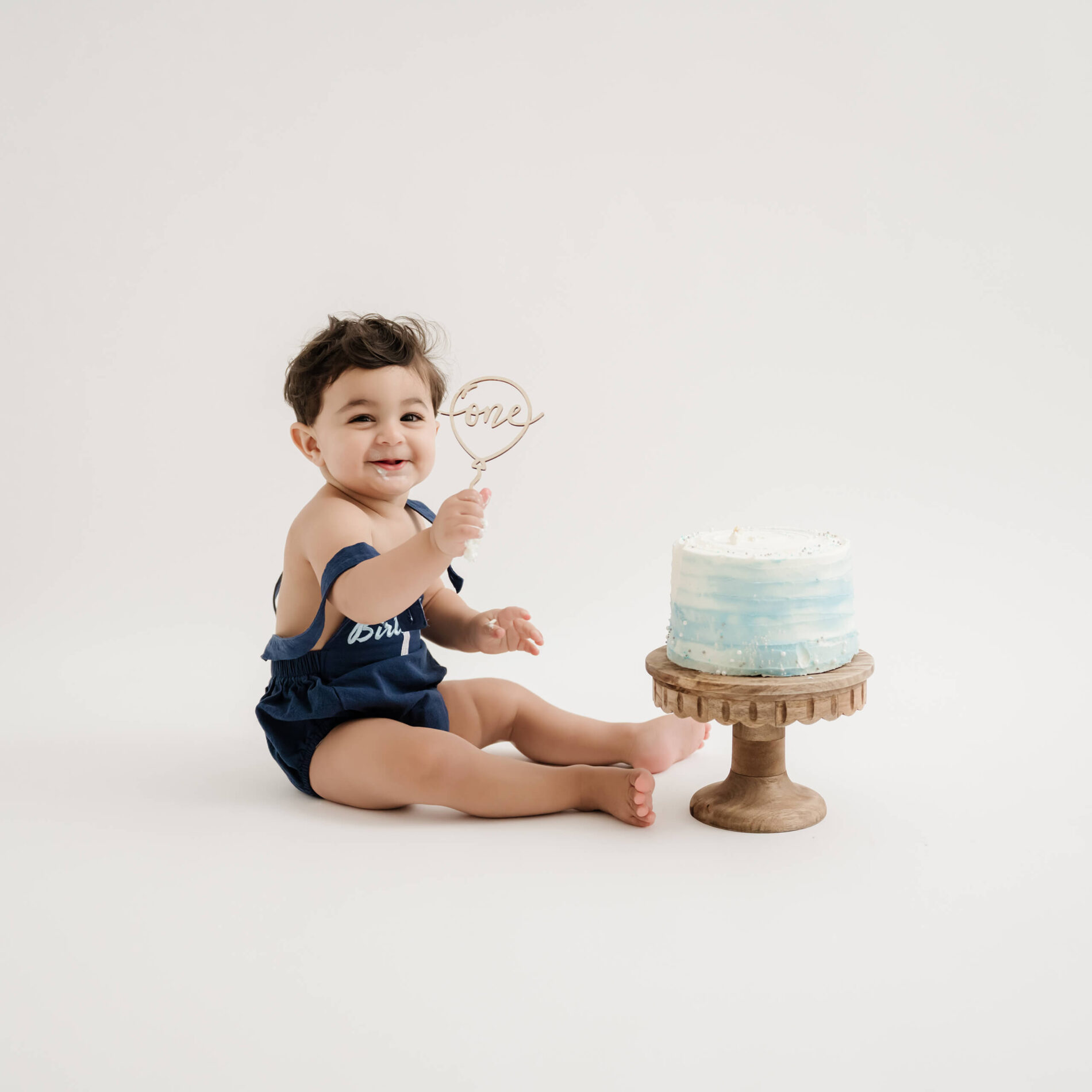Studio 1st birthday cake smash photoshoot for a boy