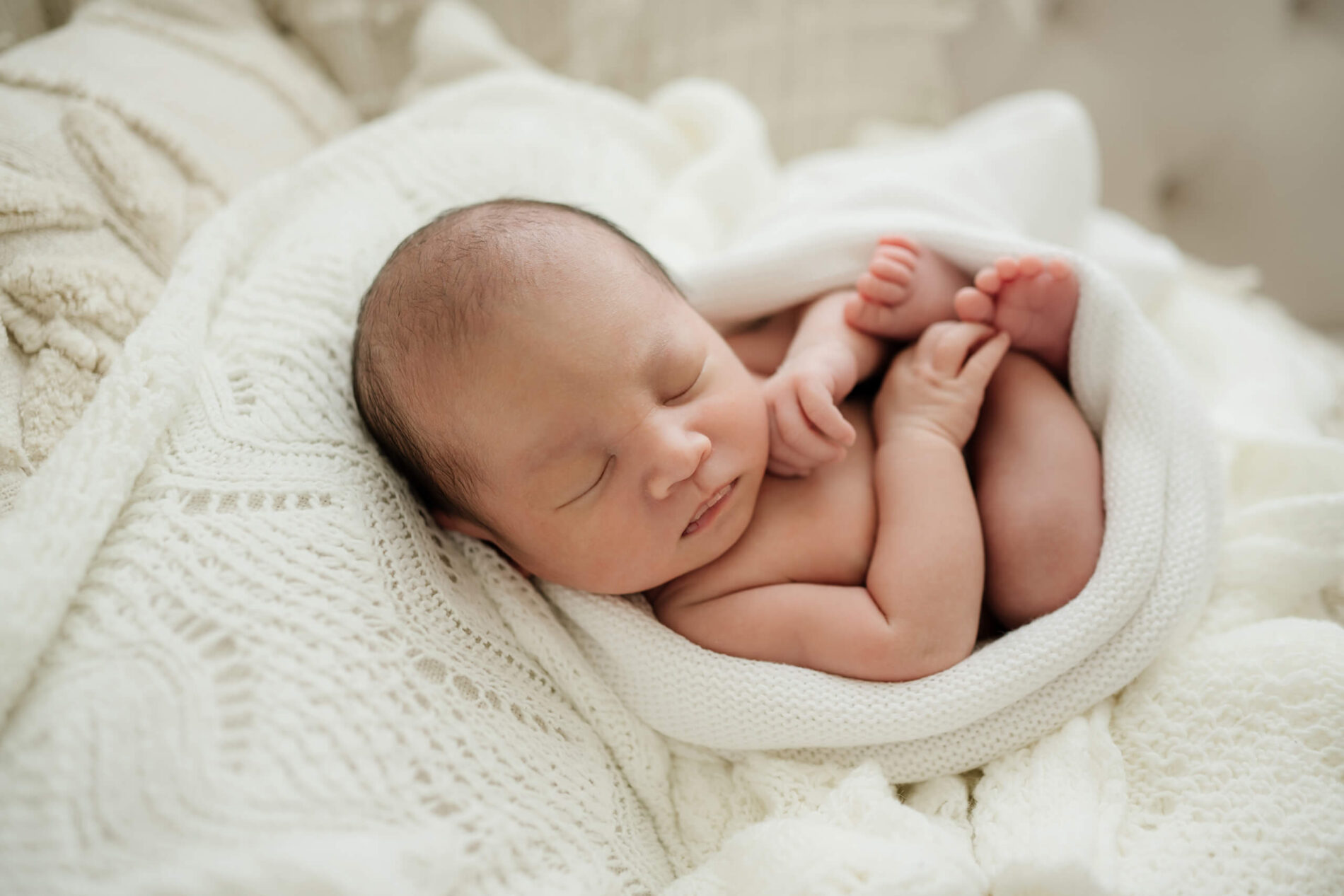 Cozy infant wrapped and photographed during in my studio near Bothell WA
