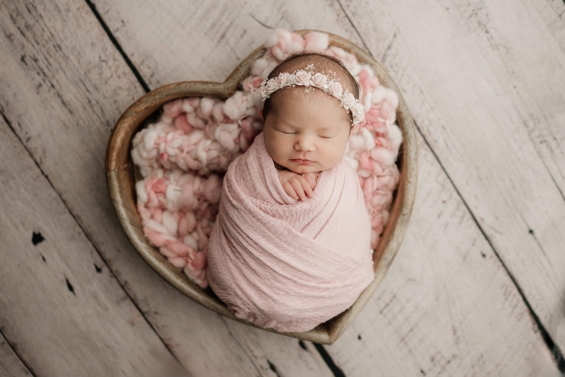 Elegant newborn studio portrait of a baby girl